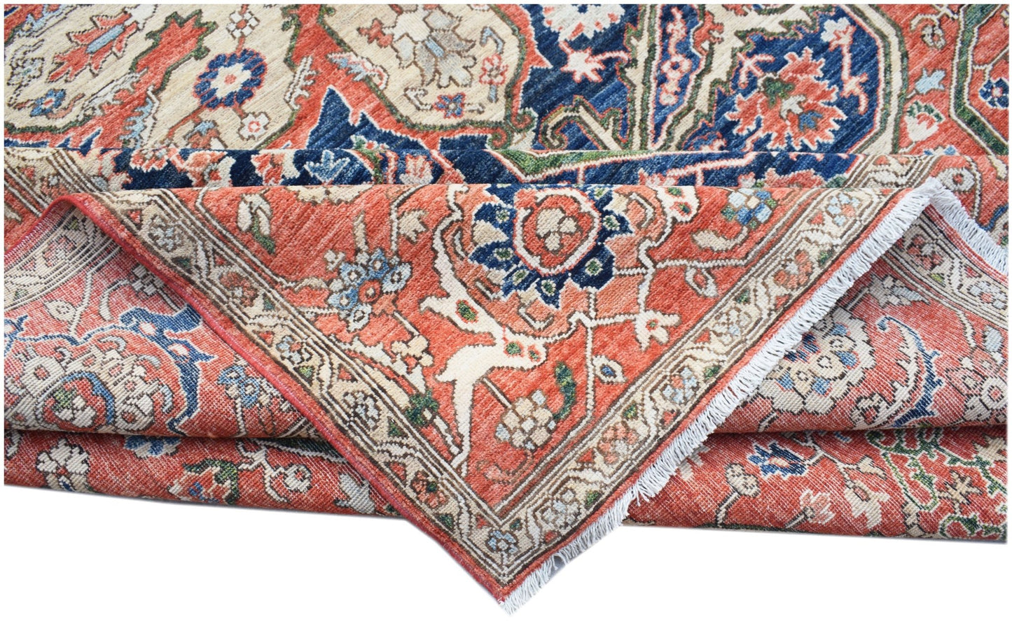 A handmade Afghan Chobi rug with a traditional Heriz pattern in red, blue, and cream tones.