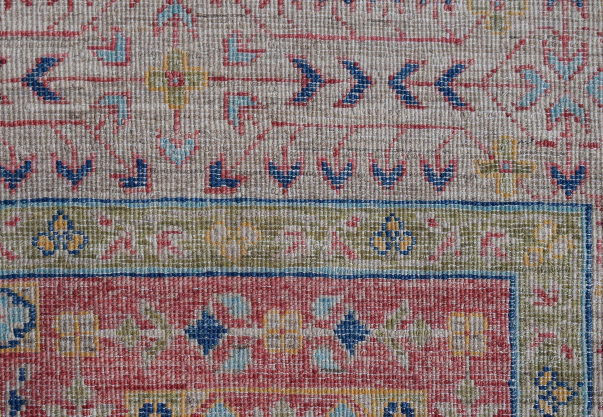 A close-up of a handwoven Afghan Chobi rug featuring a traditional Mamluk geometric pattern.