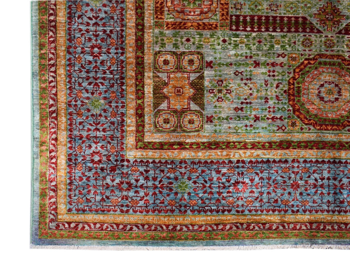 A handwoven Afghan Chobi rug featuring a detailed Mamluk pattern in blue, red, and orange tones.