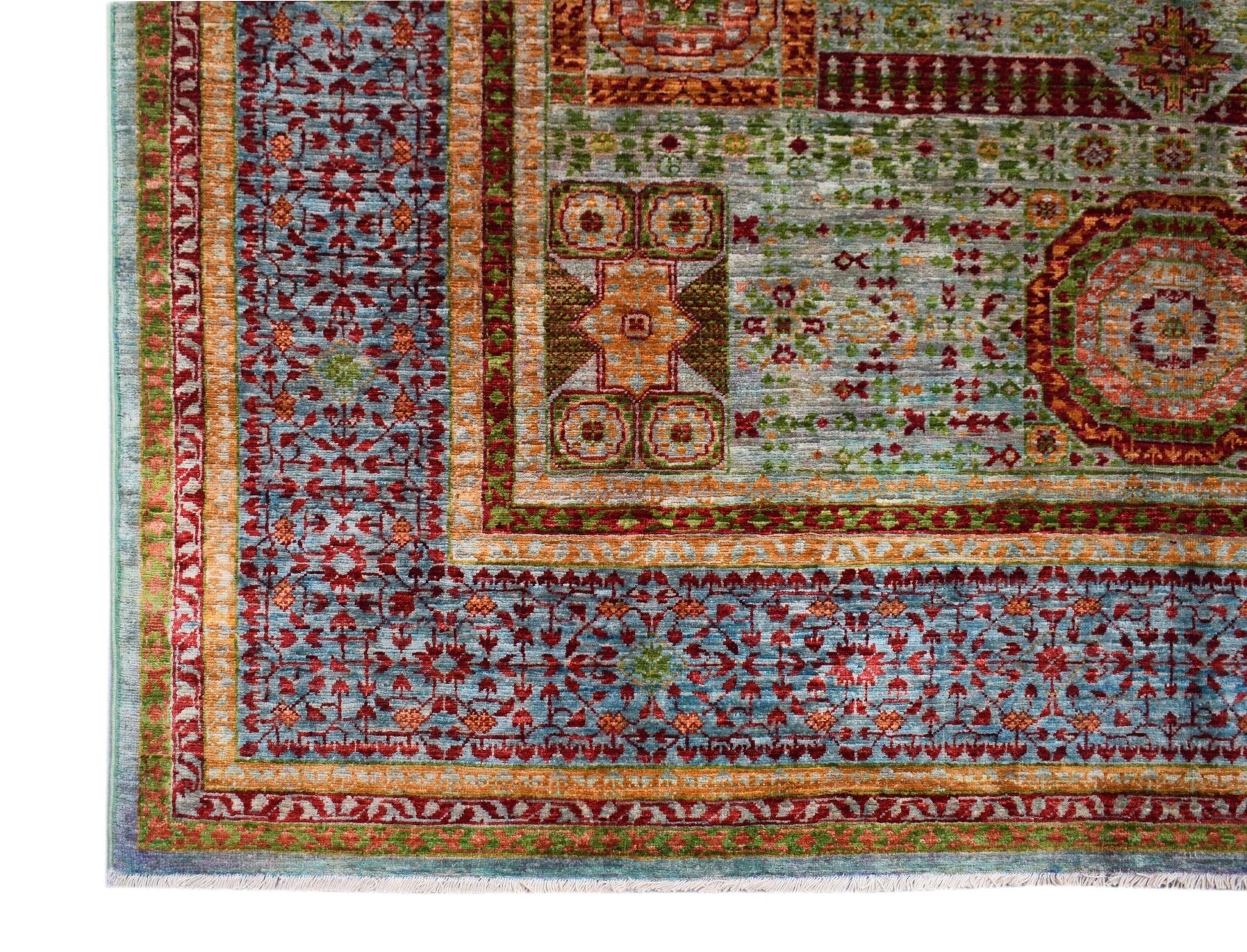 A handwoven Afghan Chobi rug featuring a detailed Mamluk pattern in blue, red, and orange tones.