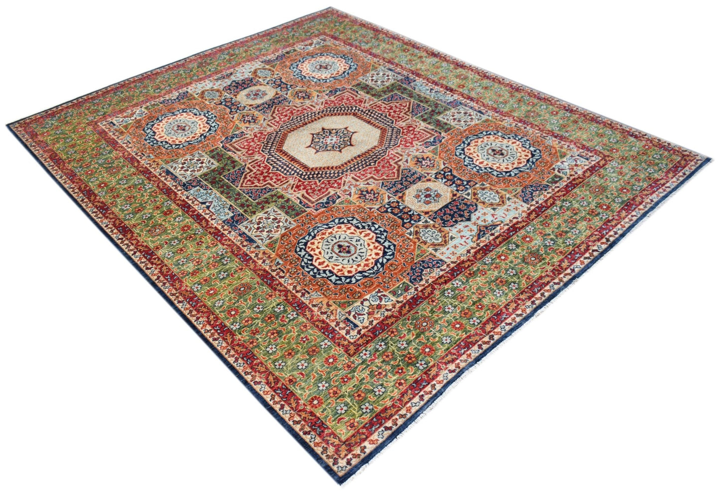 A handmade Afghan Chobi rug featuring a traditional Mamluk medallion pattern in earthy tones.