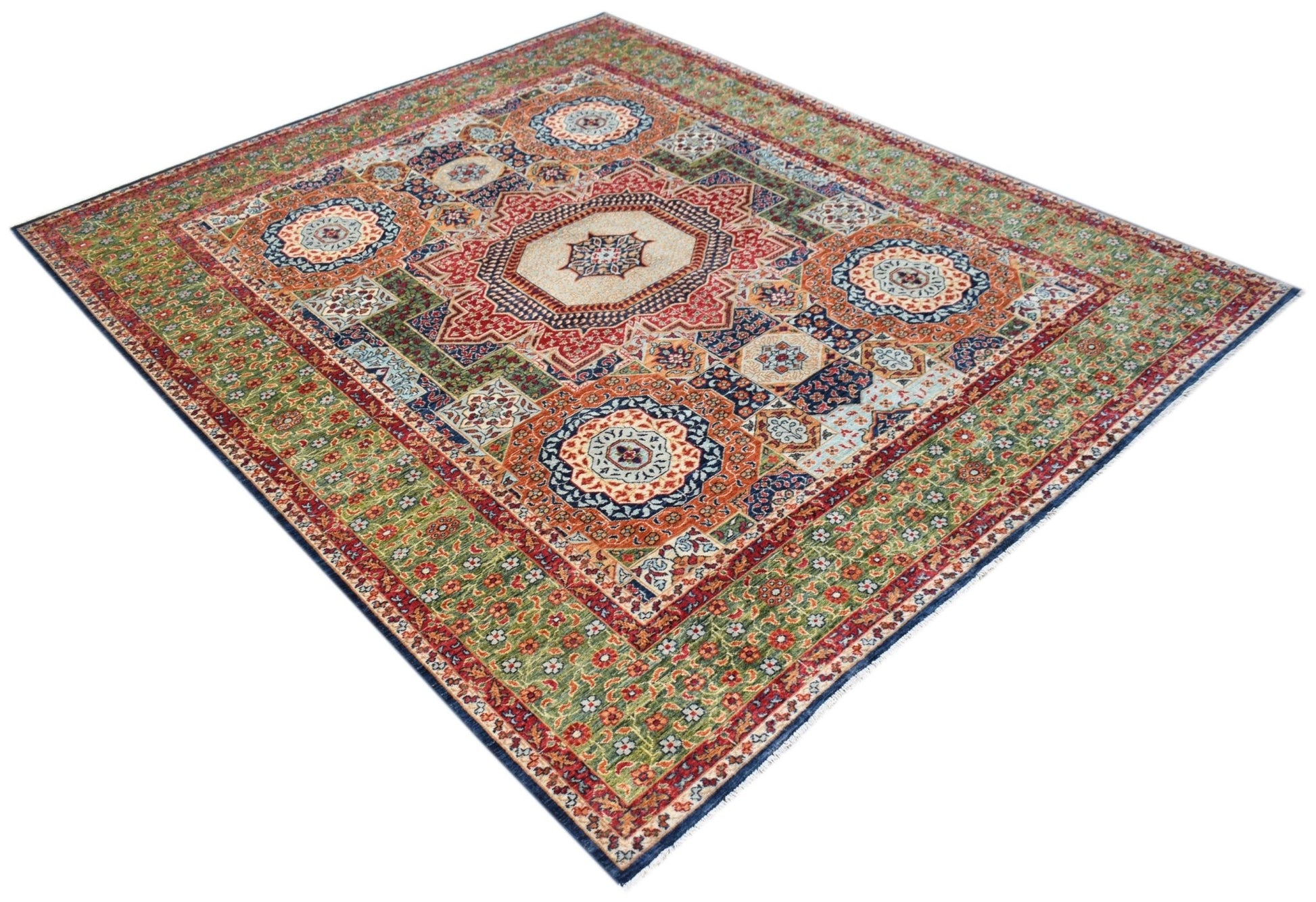 A handmade Afghan Chobi rug featuring a traditional Mamluk medallion pattern in earthy tones.