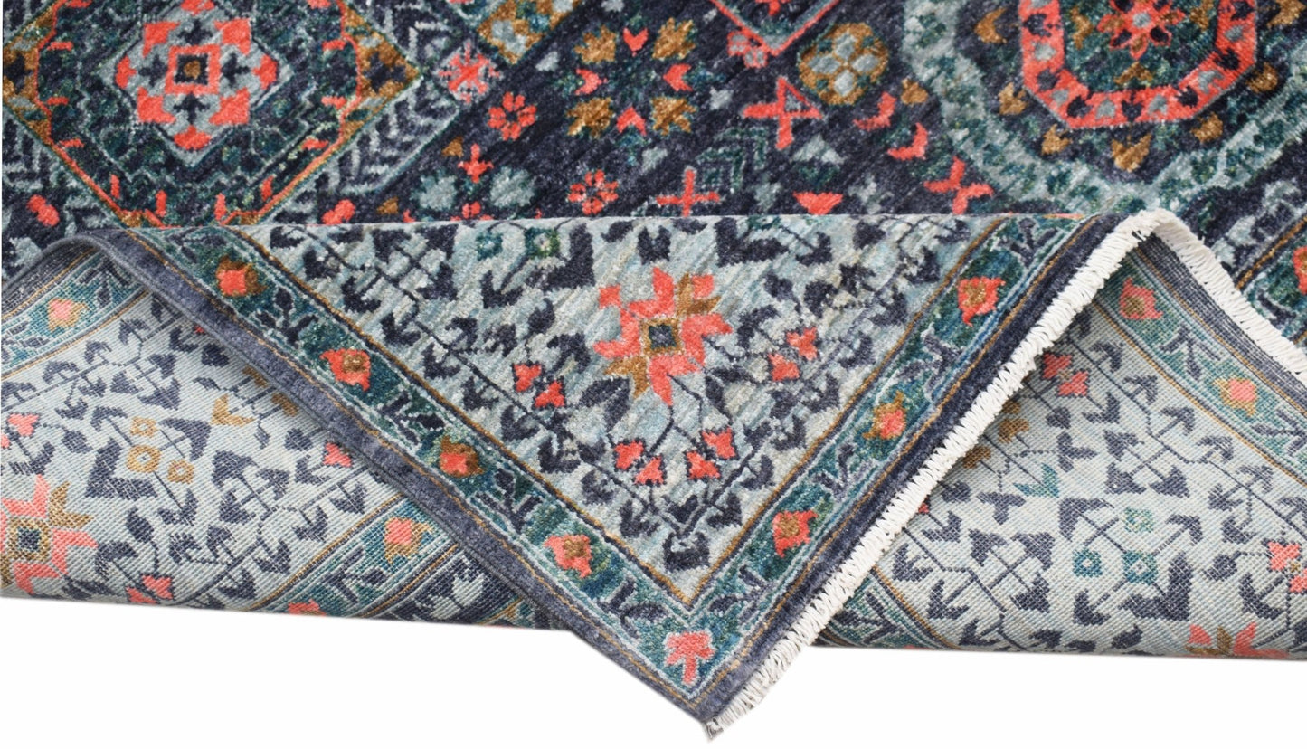 A handmade Afghan Chobi rug with a detailed Mamluk pattern in blue, red, and gold tones.