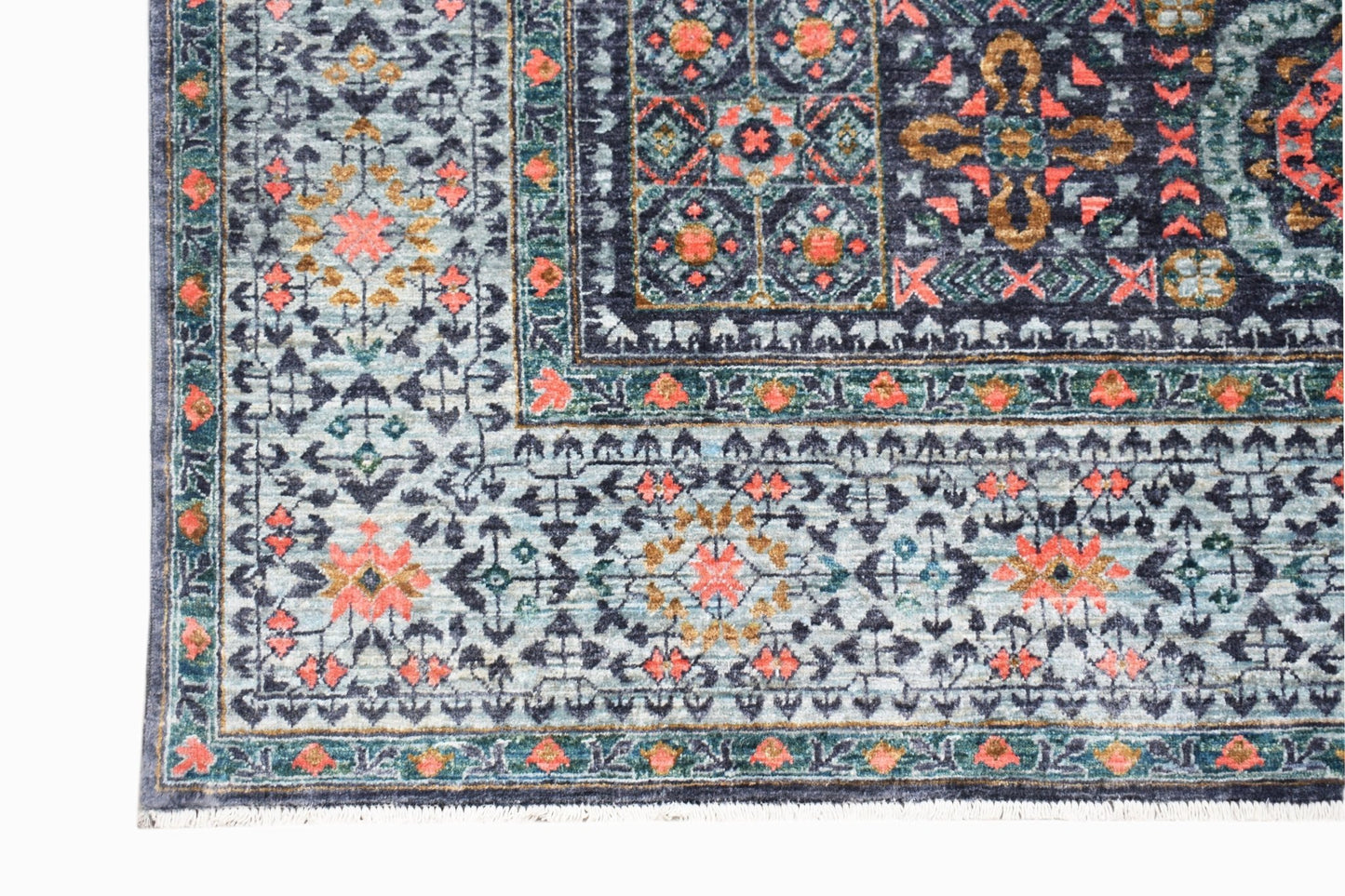 A handmade Afghan Chobi rug featuring a detailed Mamluk pattern in blue, coral, and gold tones.