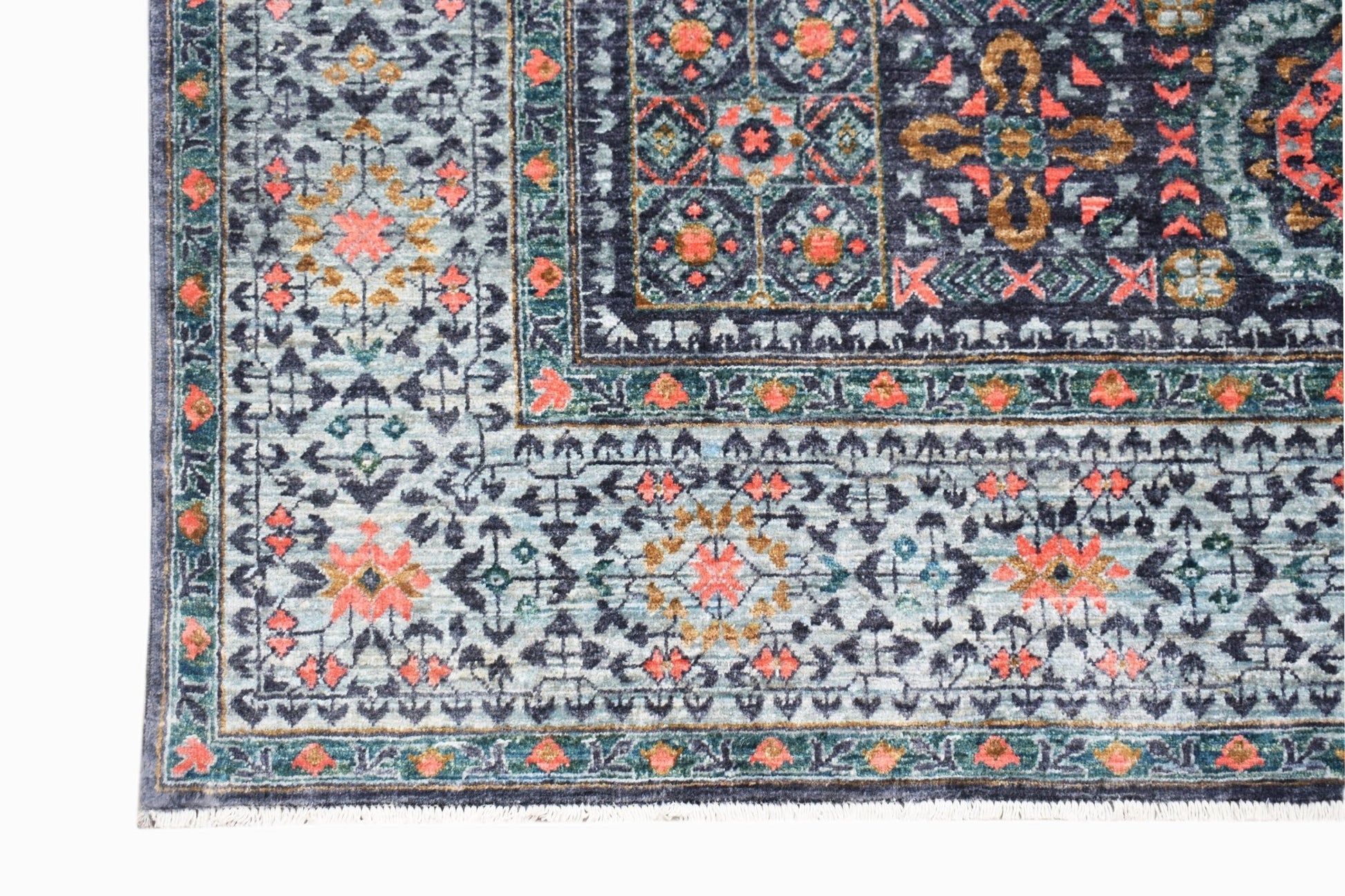 A handmade Afghan Chobi rug featuring a detailed Mamluk pattern in blue, coral, and gold tones.