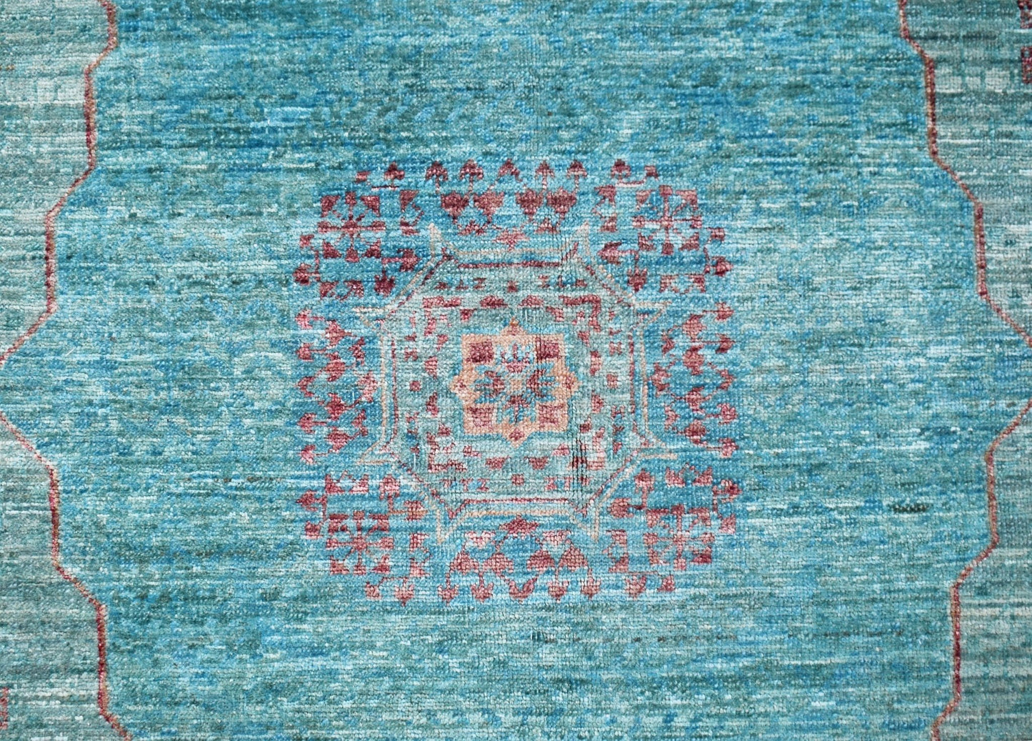 A handmade Afghan Balkh rug featuring a detailed Mamluk medallion pattern in blue and red tones.