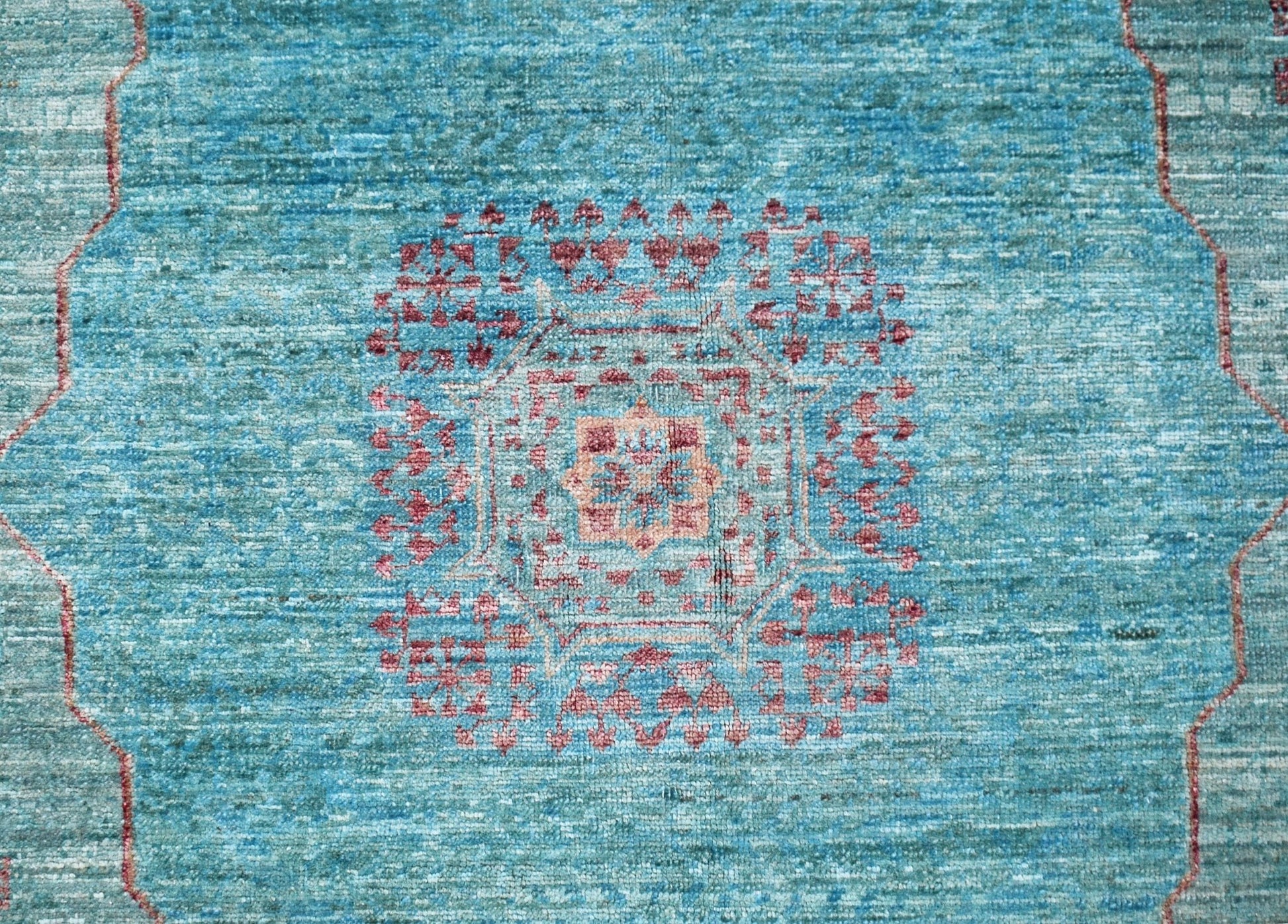 A handmade Afghan Balkh rug featuring a detailed Mamluk medallion pattern in blue and red tones.