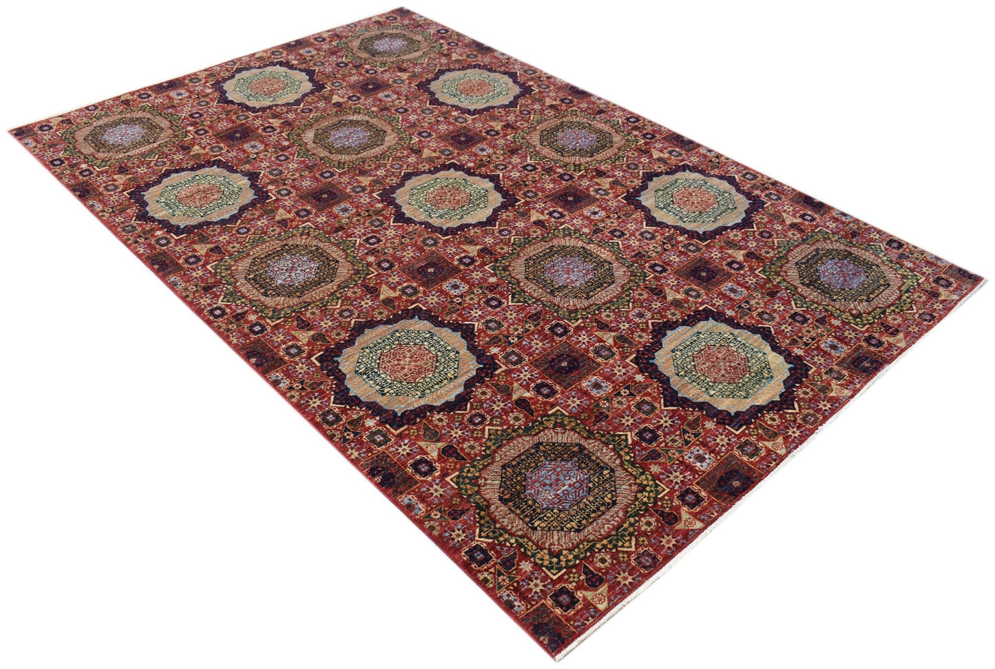 A rectangular Afghan Chobi rug featuring a traditional Mamluk pattern with geometric medallions.