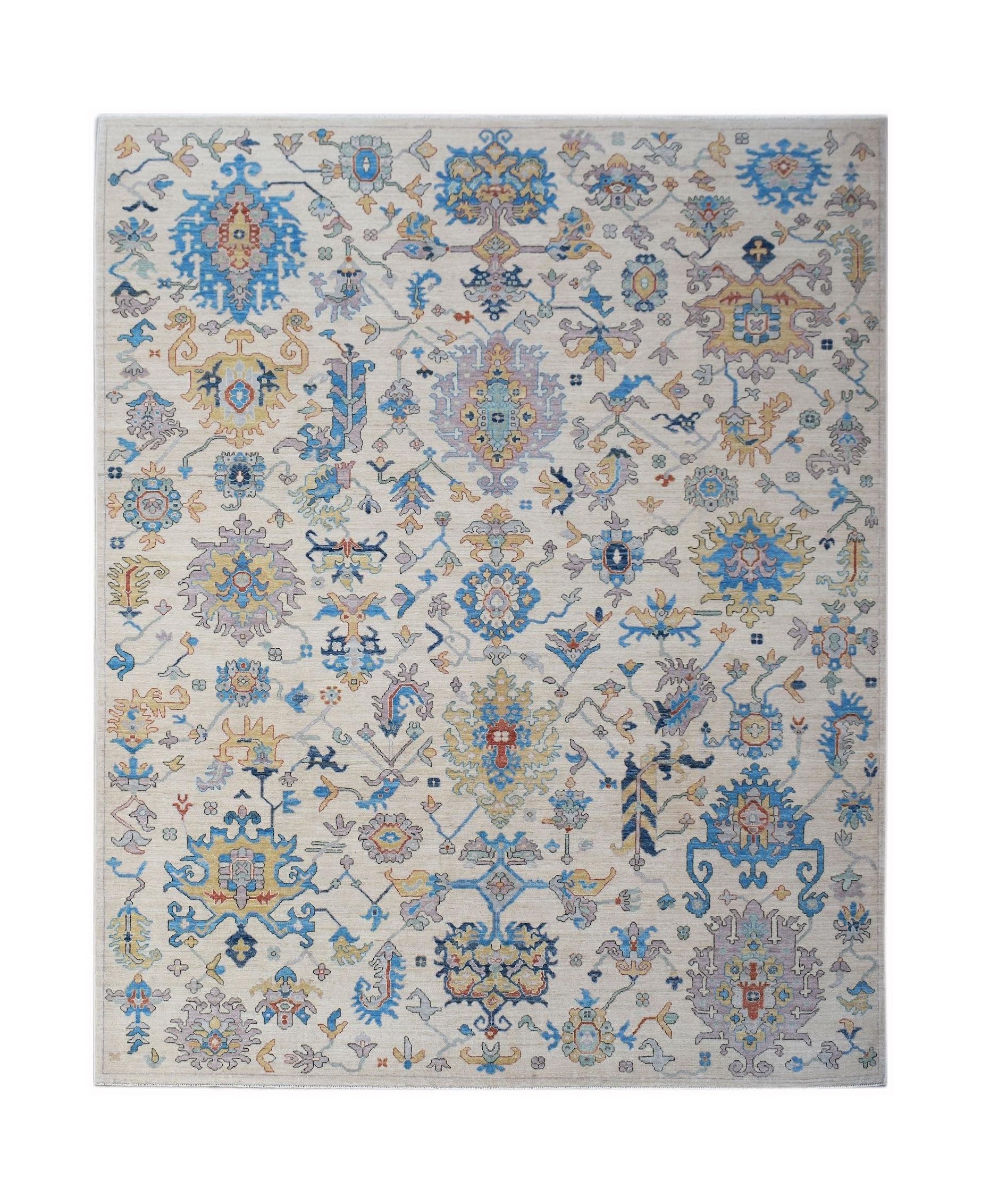 Handmade Afghan Chobi rug featuring a traditional floral pattern in blue, yellow, and cream tones.