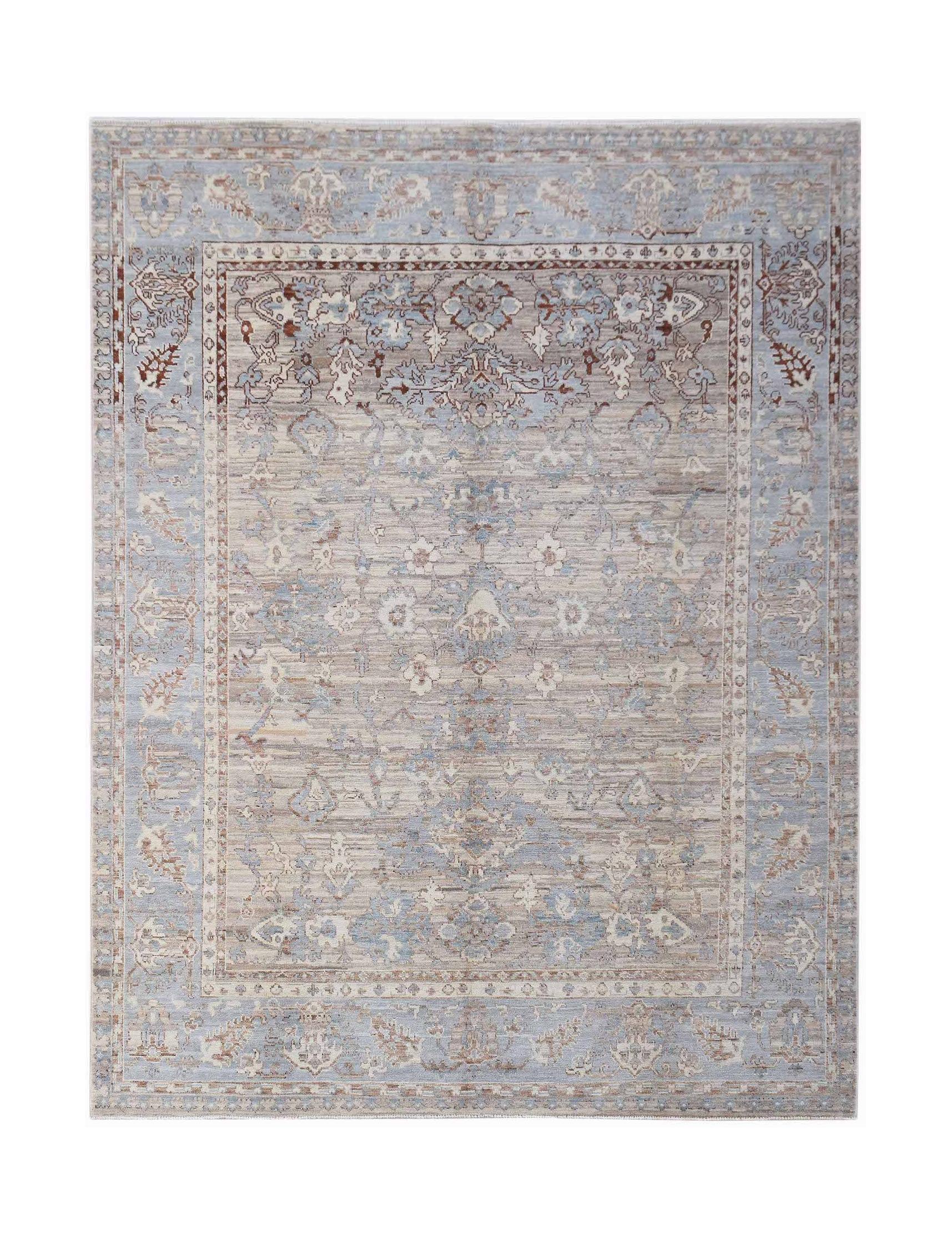 A handmade transitional Oushak rug featuring a light blue and beige floral pattern.