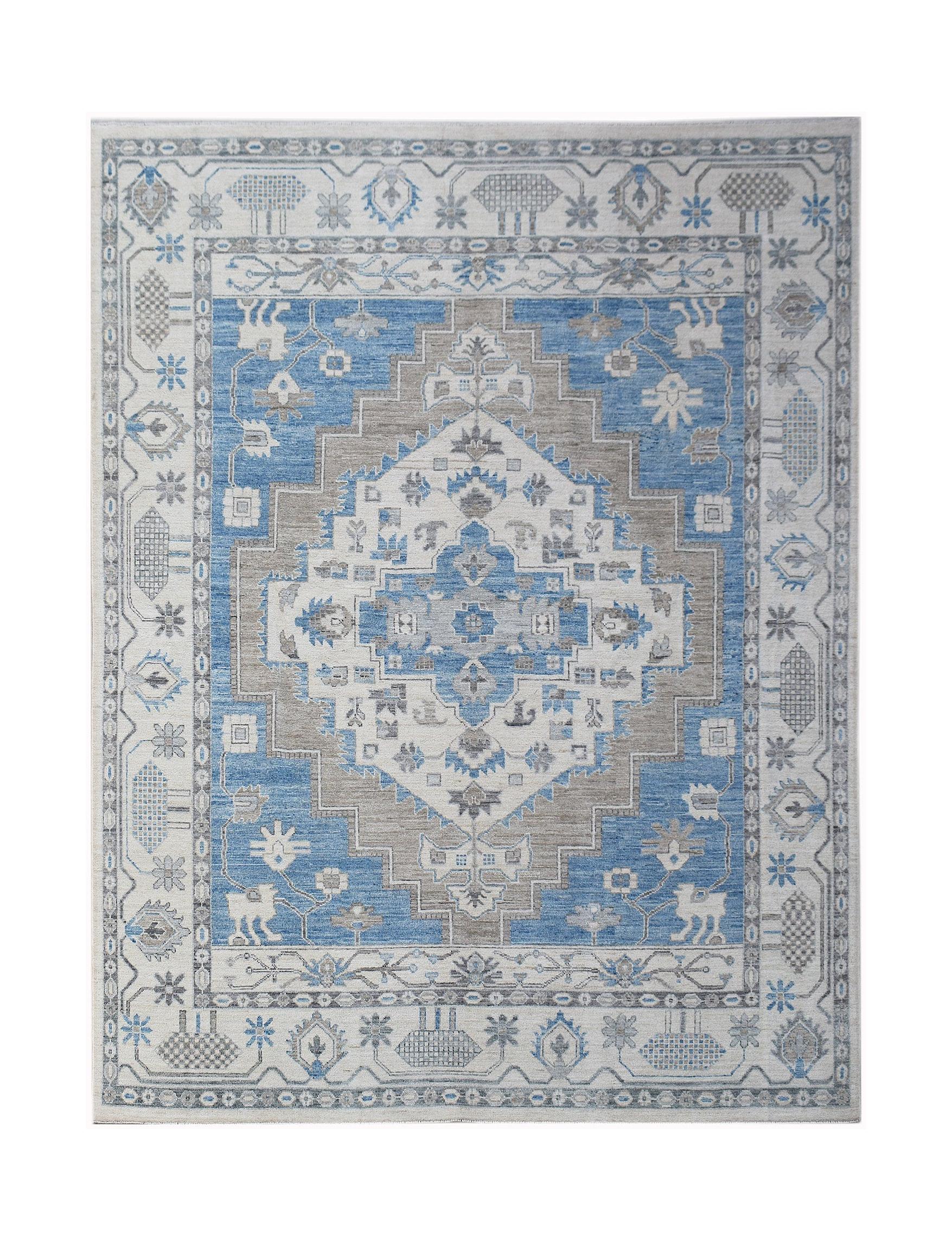 A rectangular transitional Oushak rug featuring a blue and grey geometric medallion pattern.