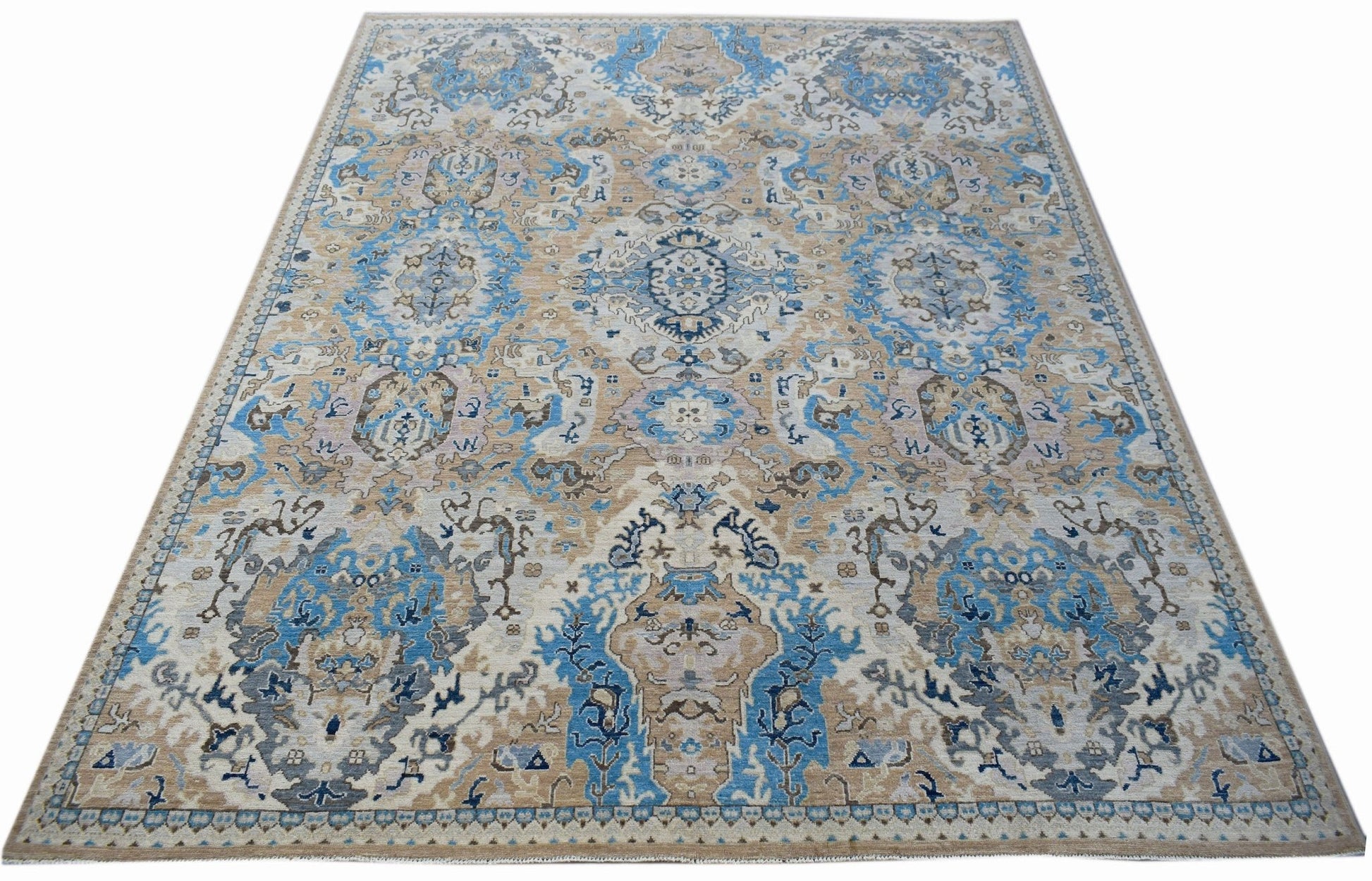 Handwoven Afghan Chobi rug featuring a traditional floral pattern in blue, beige, and grey tones.