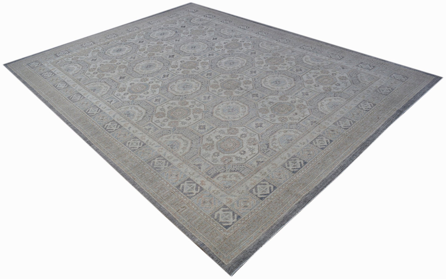 A rectangular Afghan Chobi rug featuring a traditional geometric pattern in muted earth tones.