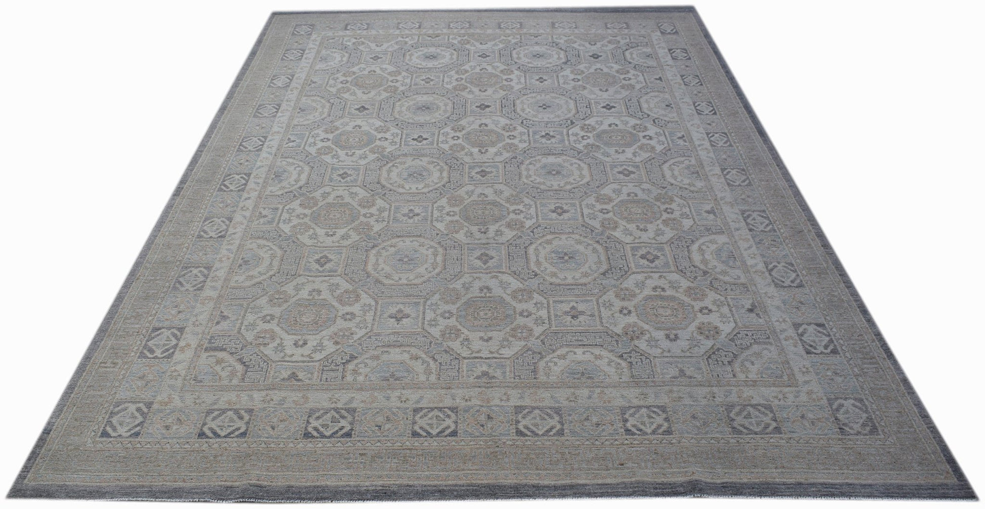 A rectangular Afghan Chobi rug featuring a traditional geometric pattern in muted earth tones.