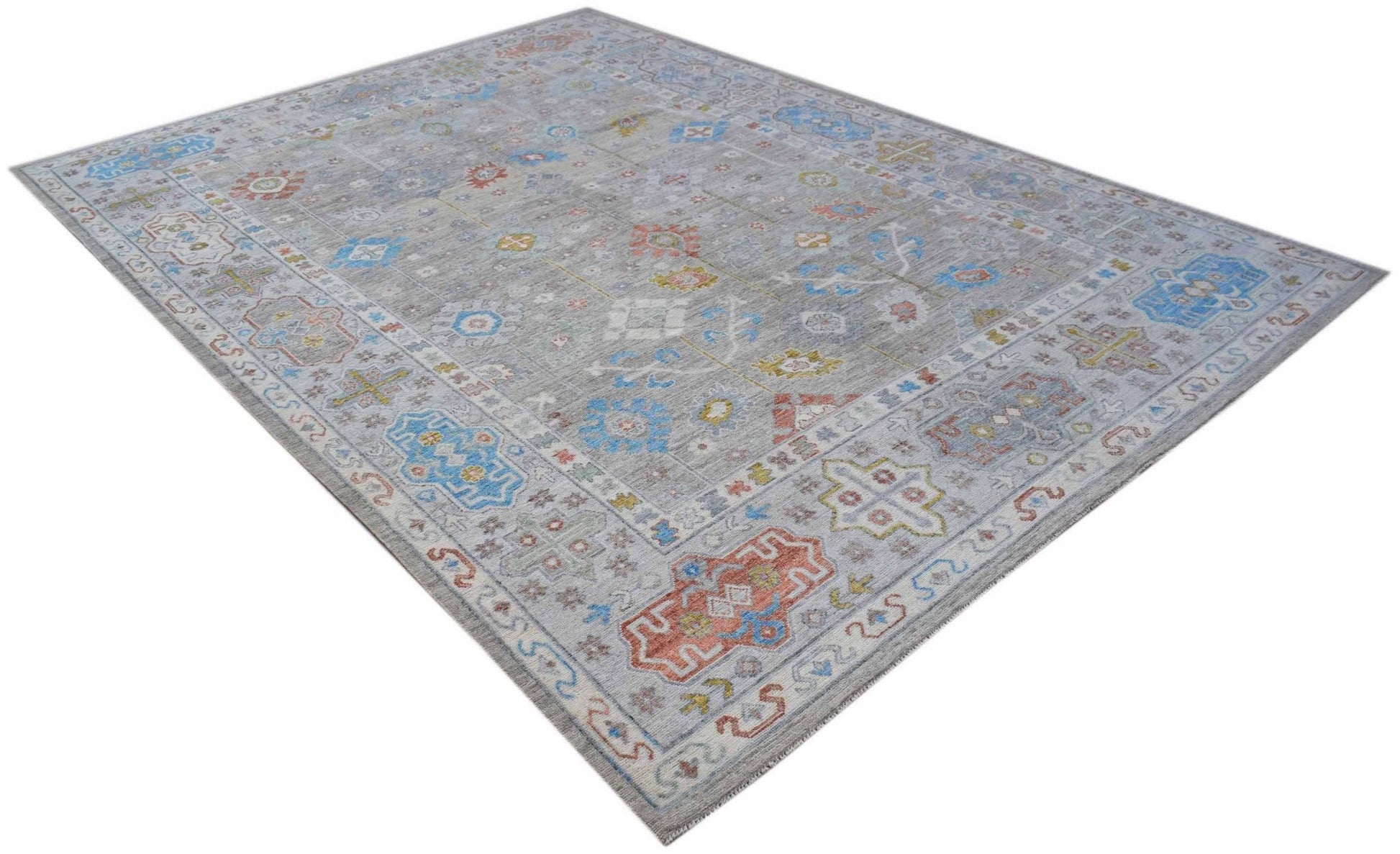 A rectangular Afghan Chobi rug featuring a grey field with colorful traditional geometric patterns.