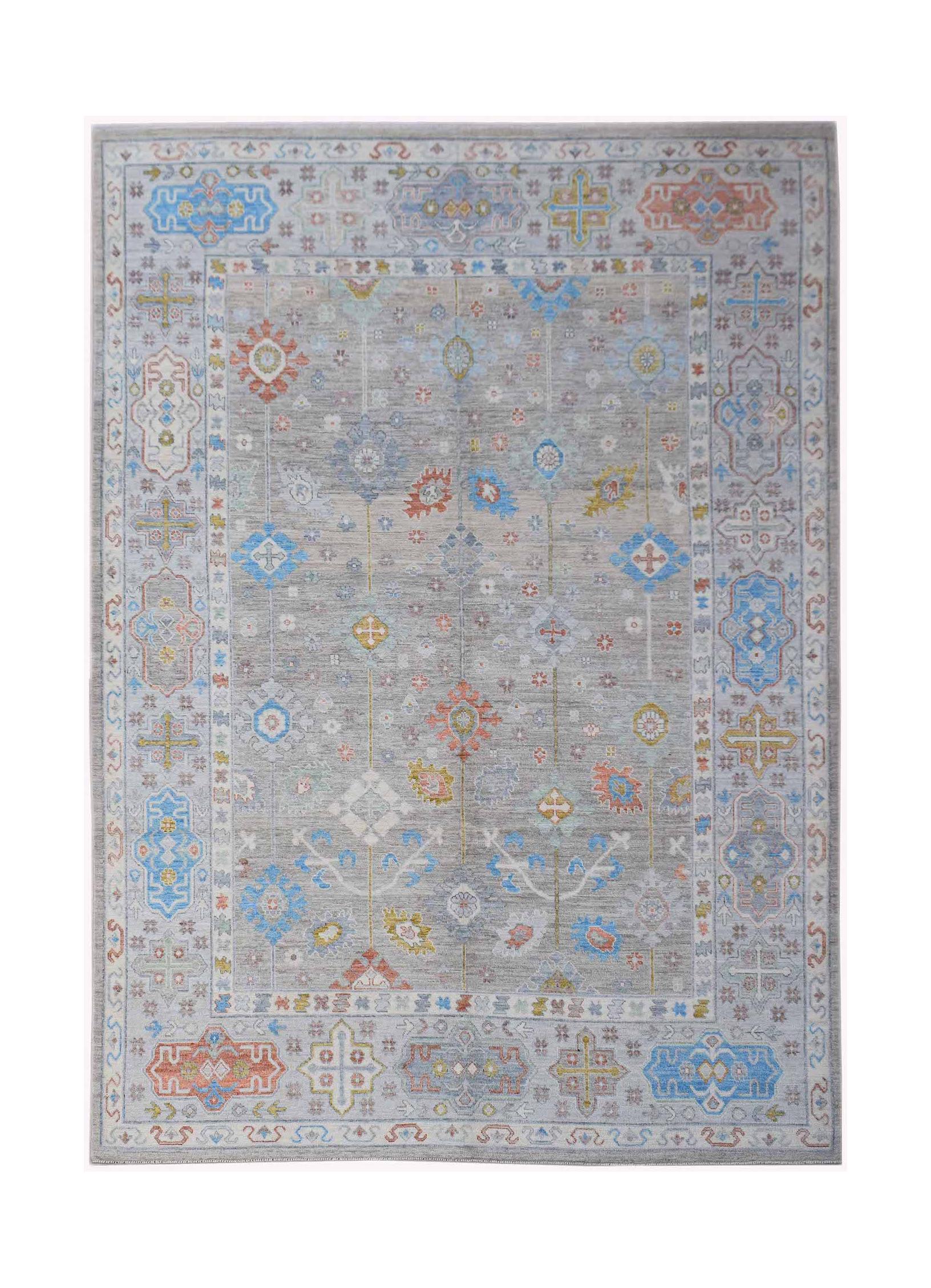 Handwoven Afghan Chobi rug featuring a grey field with colorful geometric and floral motifs.