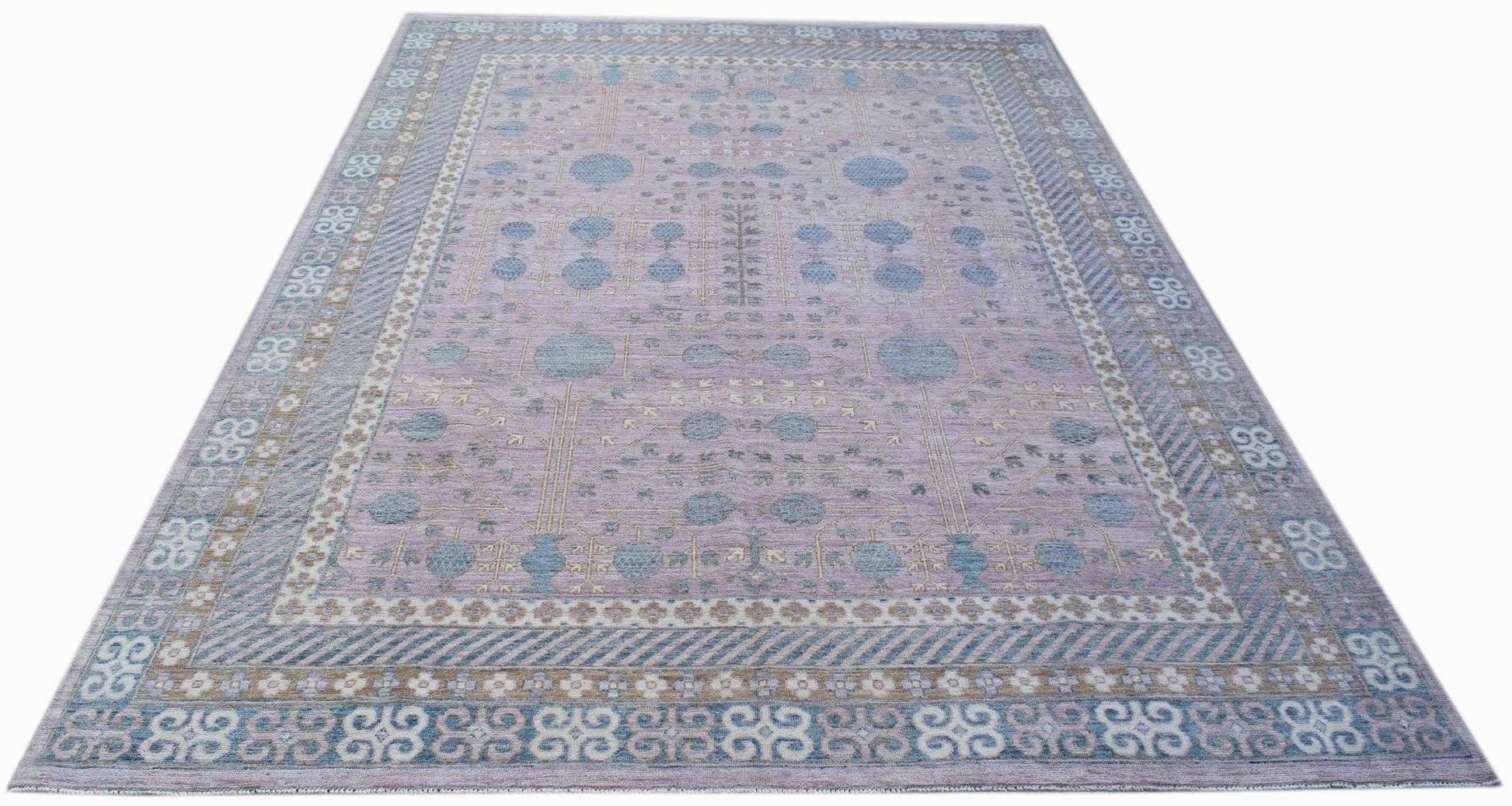 A rectangular Afghan Chobi rug featuring a lavender field with blue pomegranate motifs.