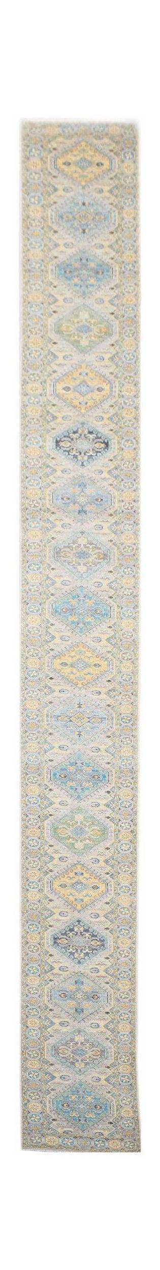 A long, handwoven Afghan Chobi runner rug featuring a repeating diamond pattern in blue and yellow.