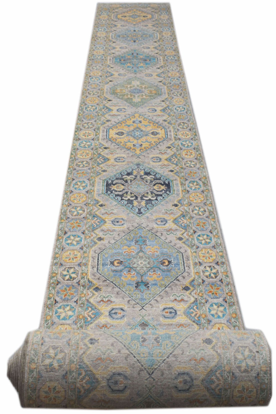 A long, handwoven Afghan Chobi runner featuring a traditional diamond pattern in blue and yellow.