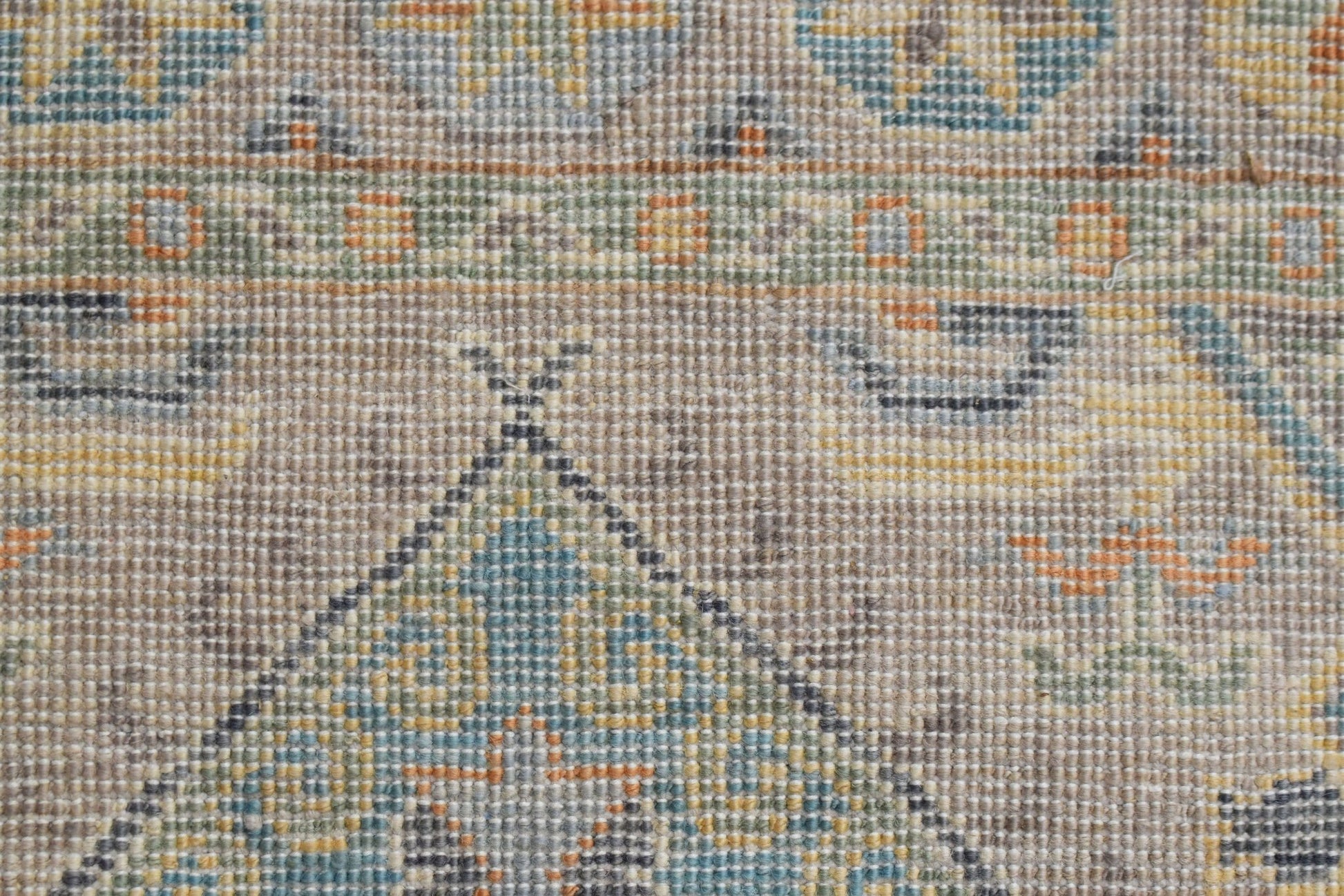 A close-up view of a handwoven Afghan Chobi runner featuring intricate geometric patterns.