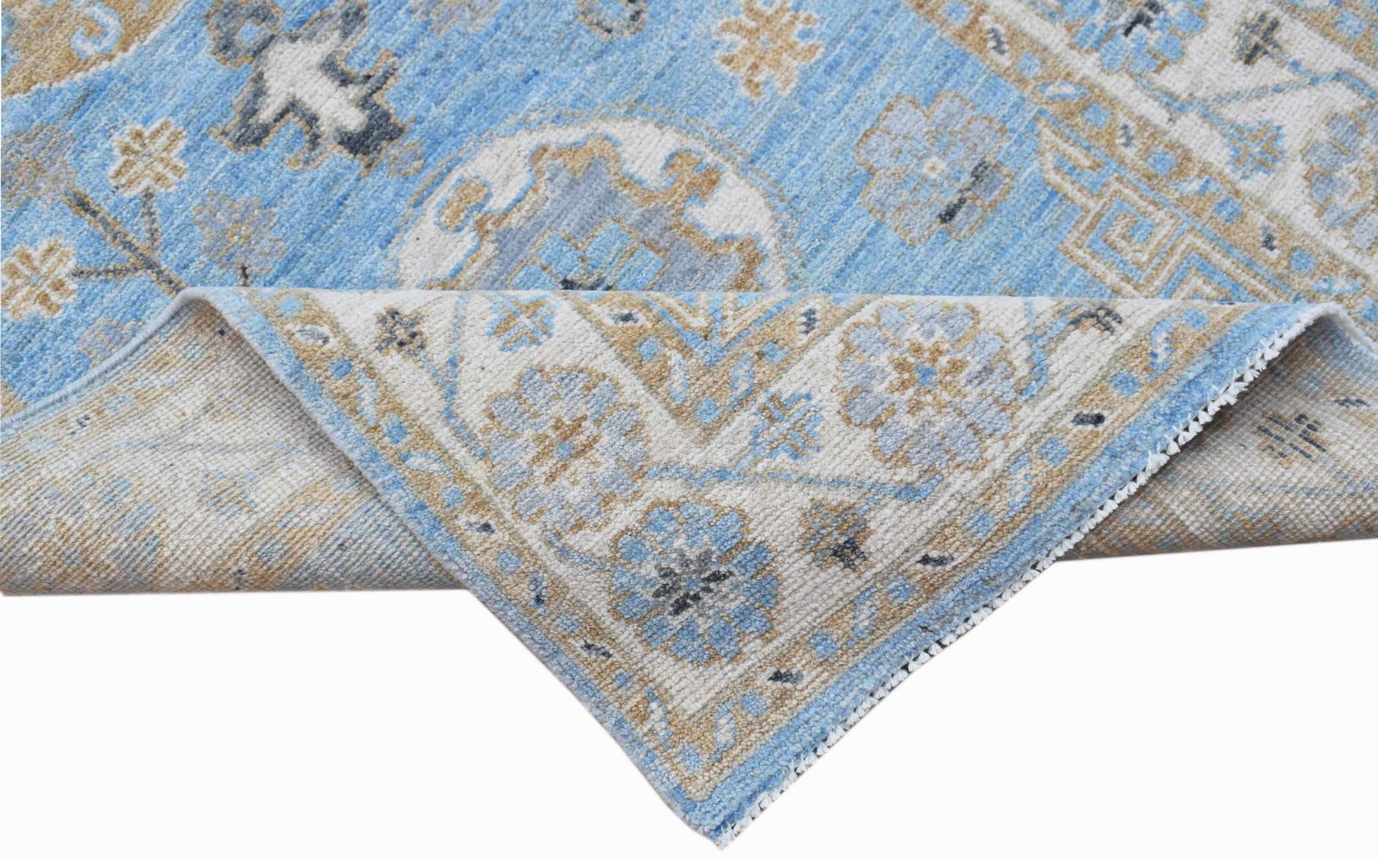 A handwoven Afghan Chobi runner featuring a traditional floral pattern in blue and beige tones.