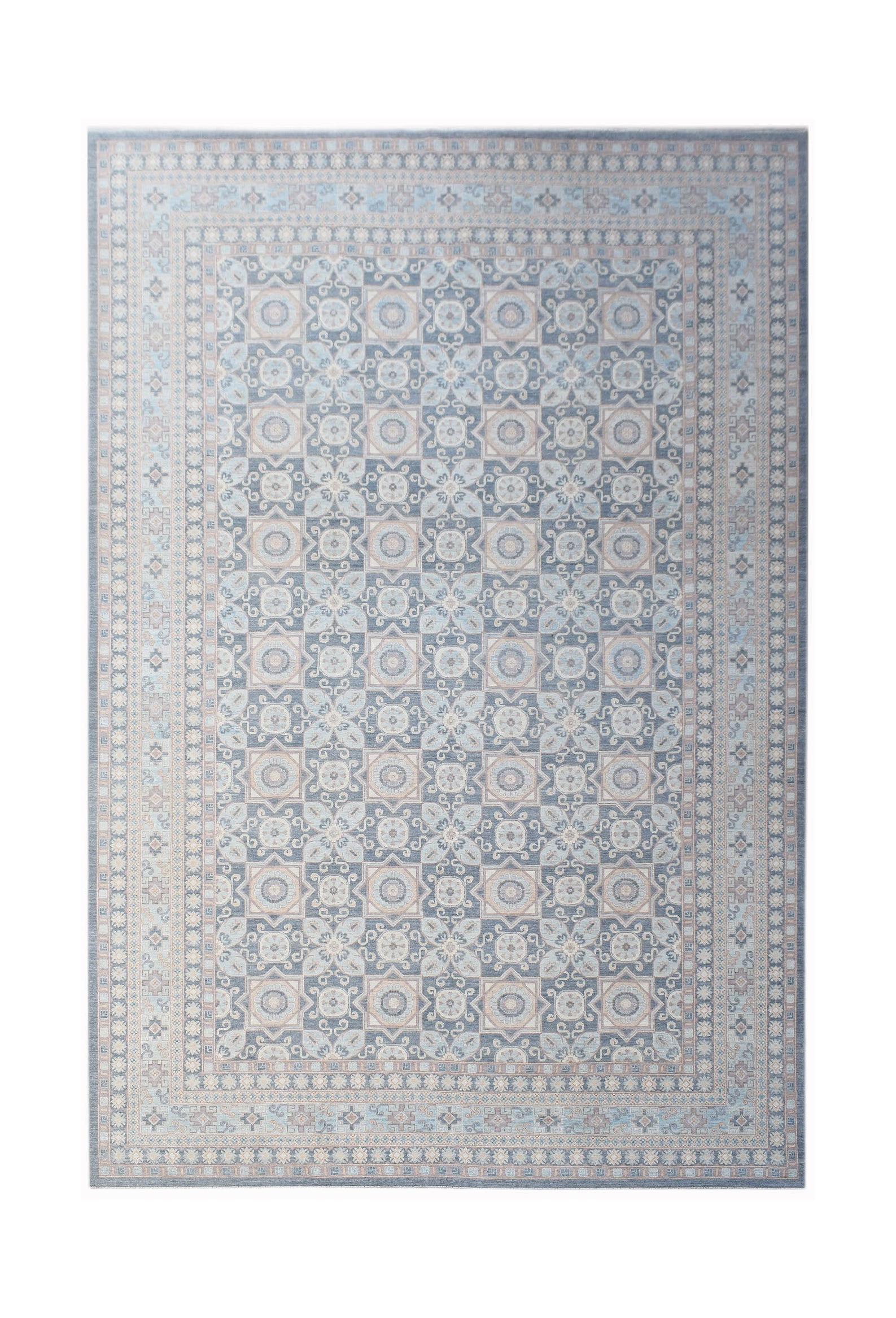 A rectangular Afghan Chobi rug featuring a repeating geometric floral pattern in blue and beige.