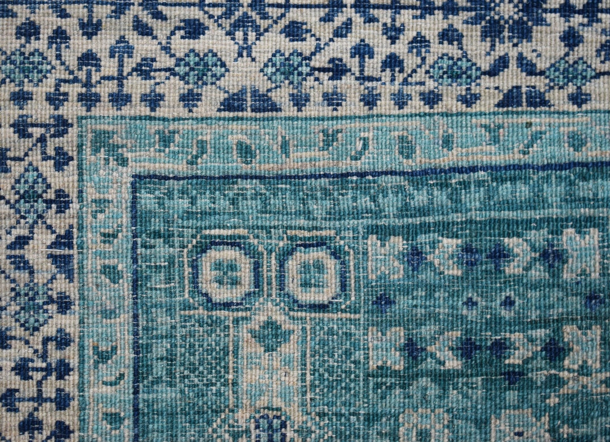 A handwoven Afghan Balkh rug featuring a detailed blue and cream Mamluk geometric pattern.