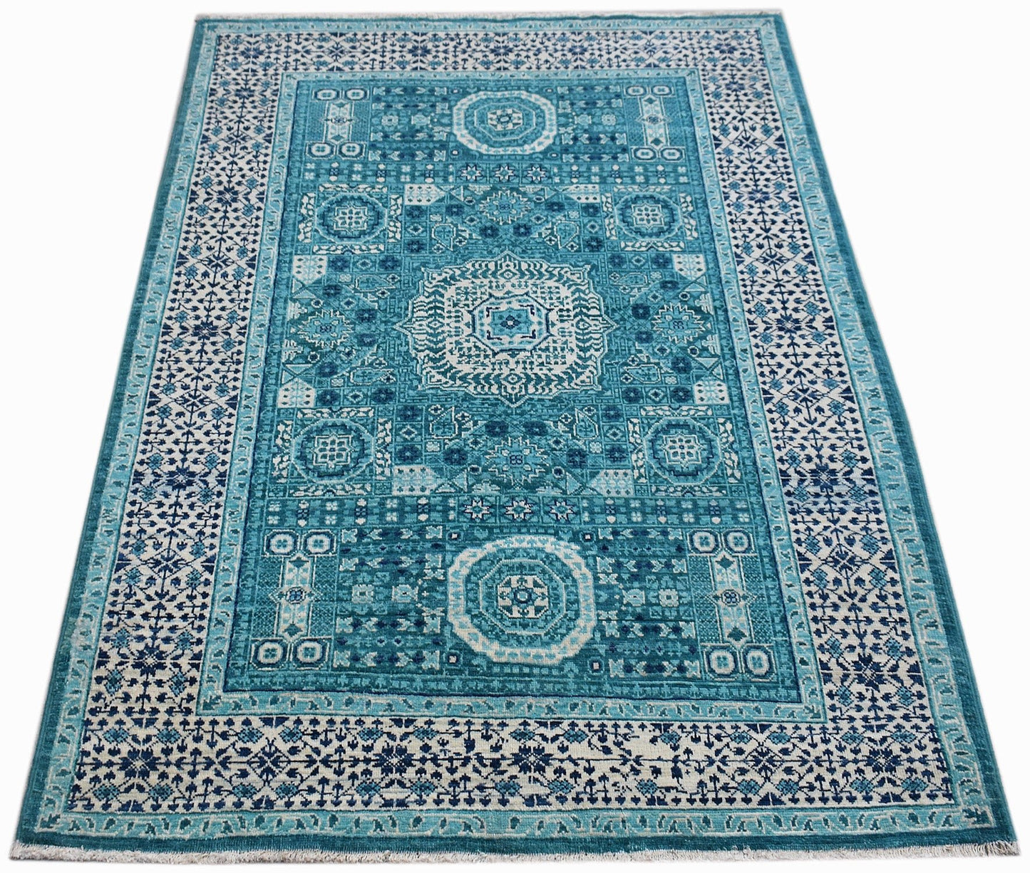 Handwoven Afghan Balkh rug featuring a detailed blue and white Mamluk medallion pattern.