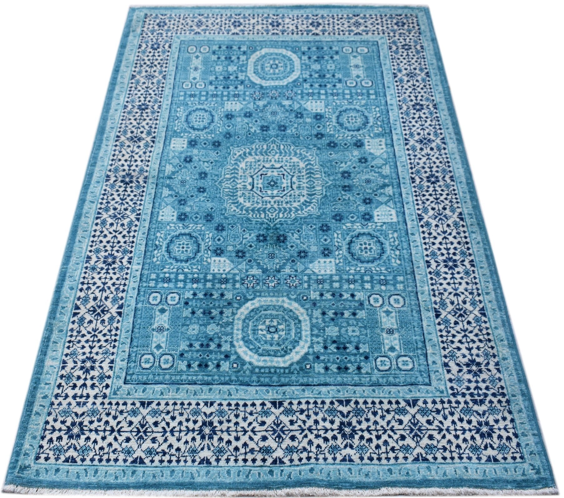 A rectangular, handwoven Afghan Chobi rug featuring a detailed blue Mamluk medallion pattern.