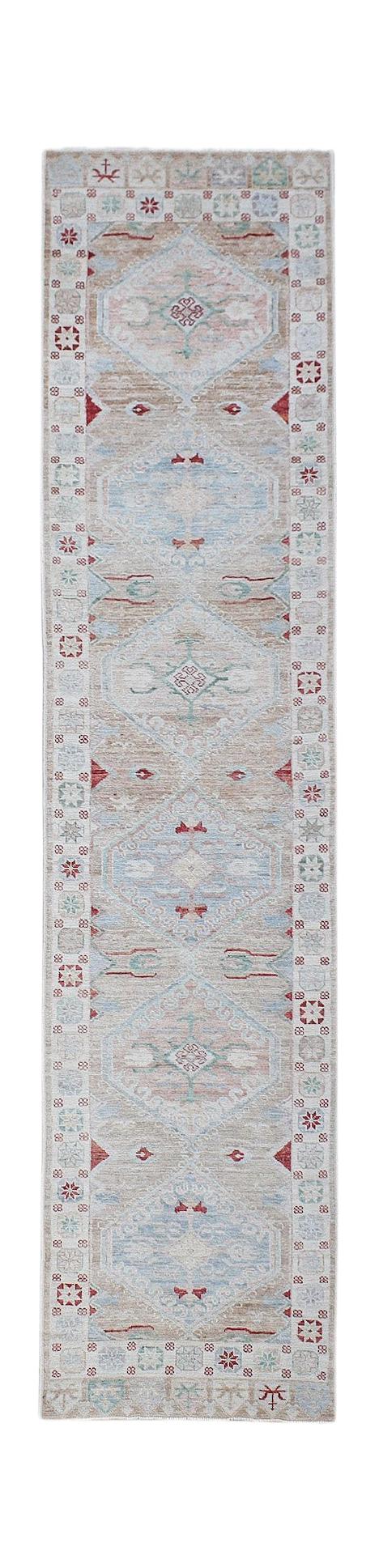 A handwoven transitional Oushak runner rug featuring a repeating diamond pattern in soft tones.