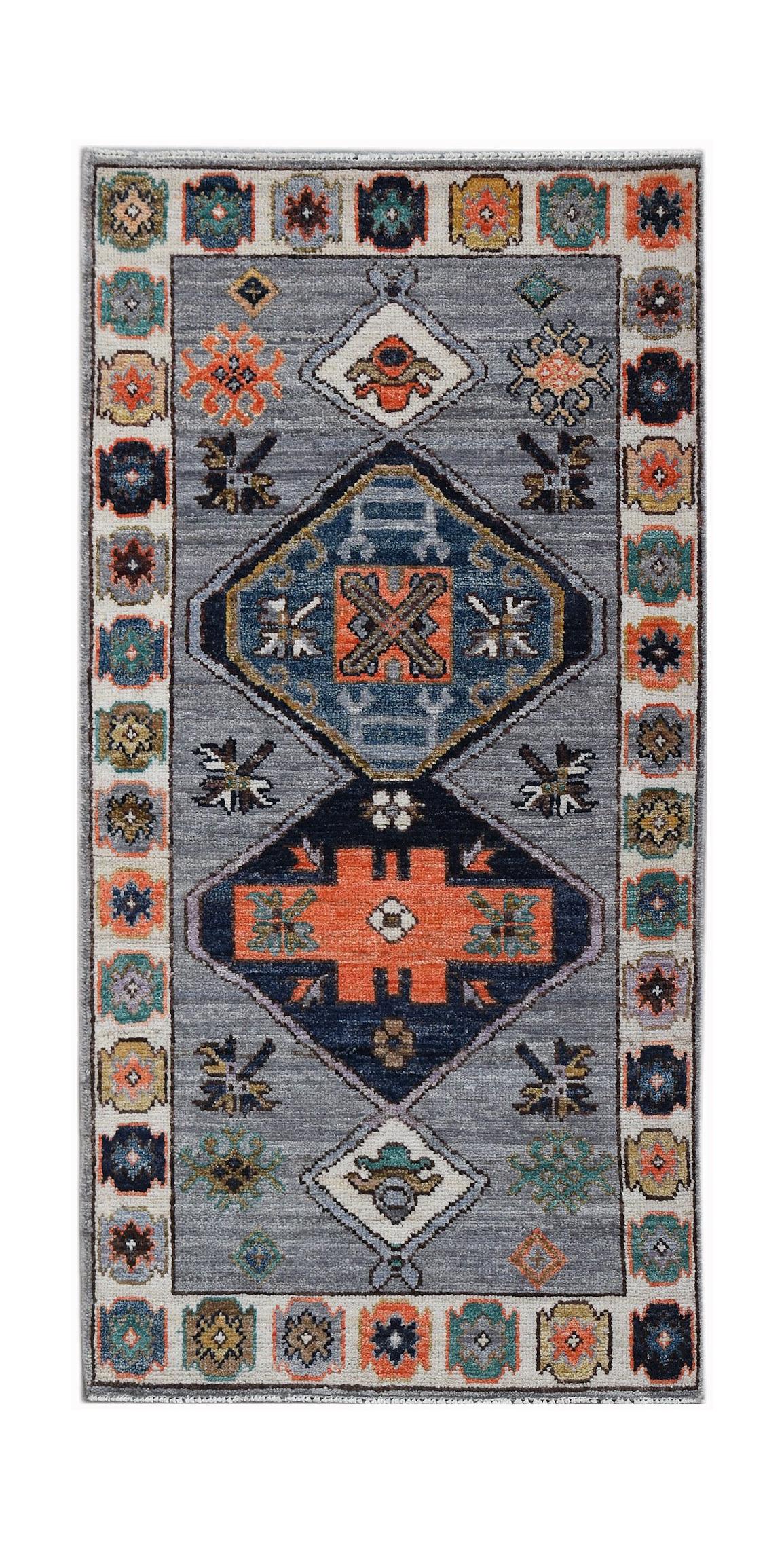 A handwoven transitional Oushak rug featuring geometric patterns in blue, orange, and grey tones.