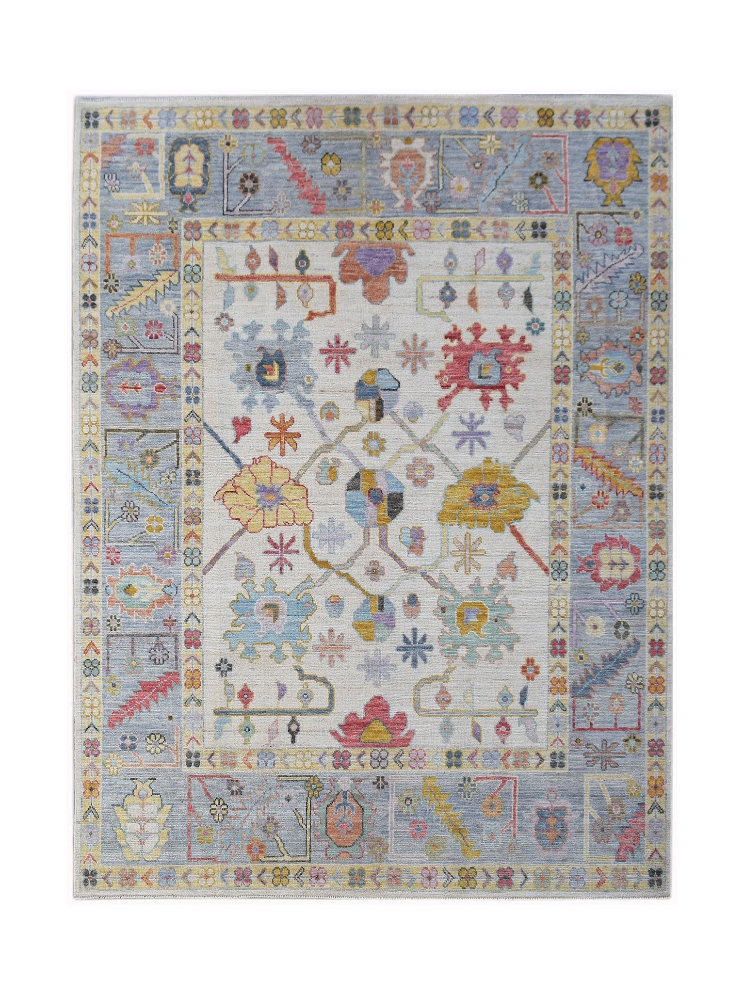 A transitional Oushak rug featuring a floral pattern in soft colors on a light cream background.