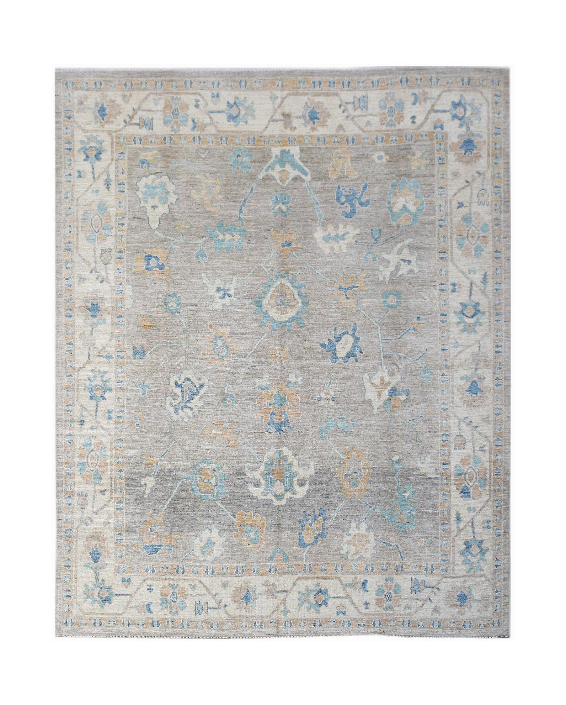 A handwoven transitional Oushak rug featuring a floral pattern in blue and tan on a grey field.