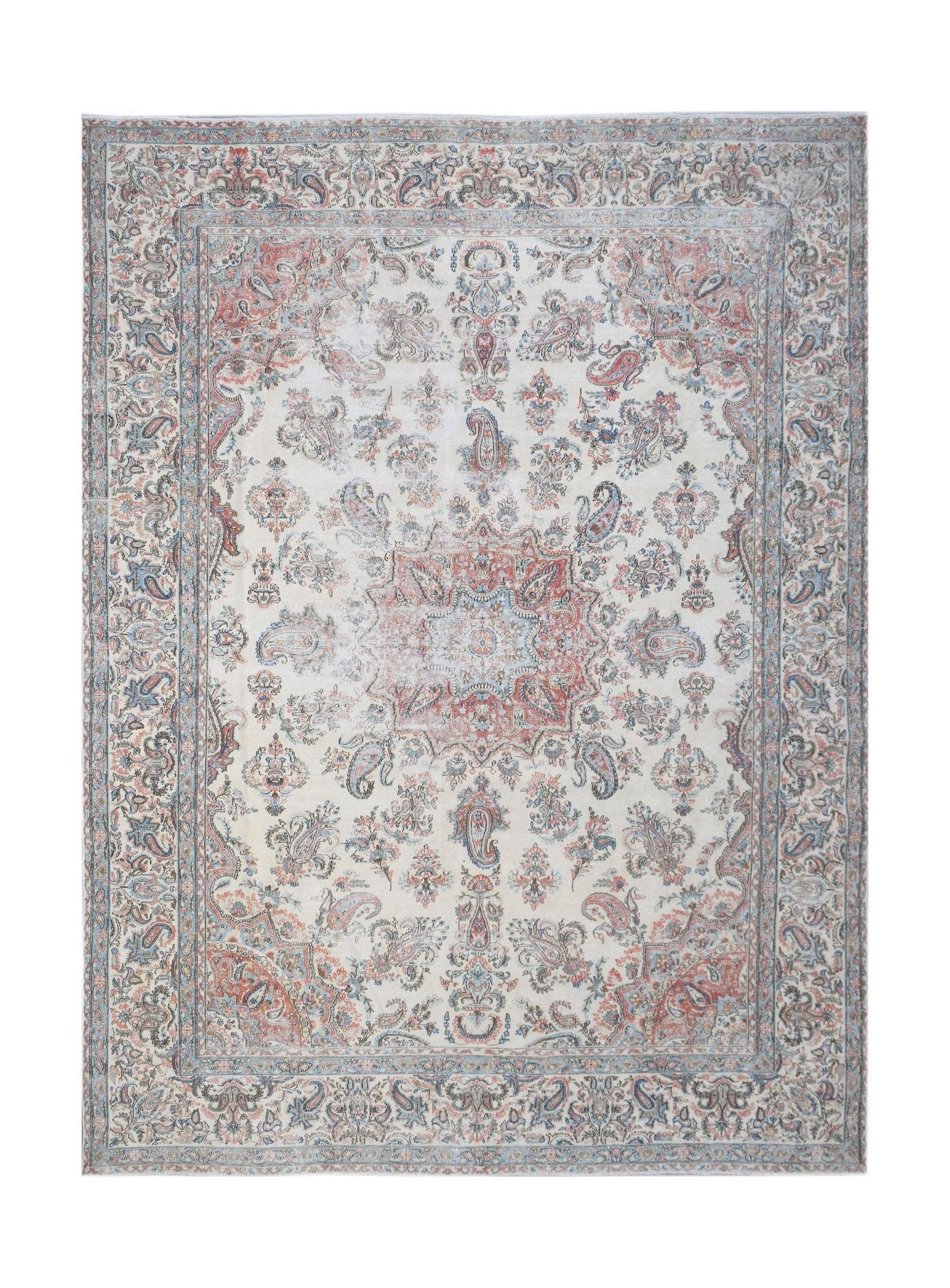 Vintage Persian Kerman rug featuring a central medallion and intricate floral paisley patterns.