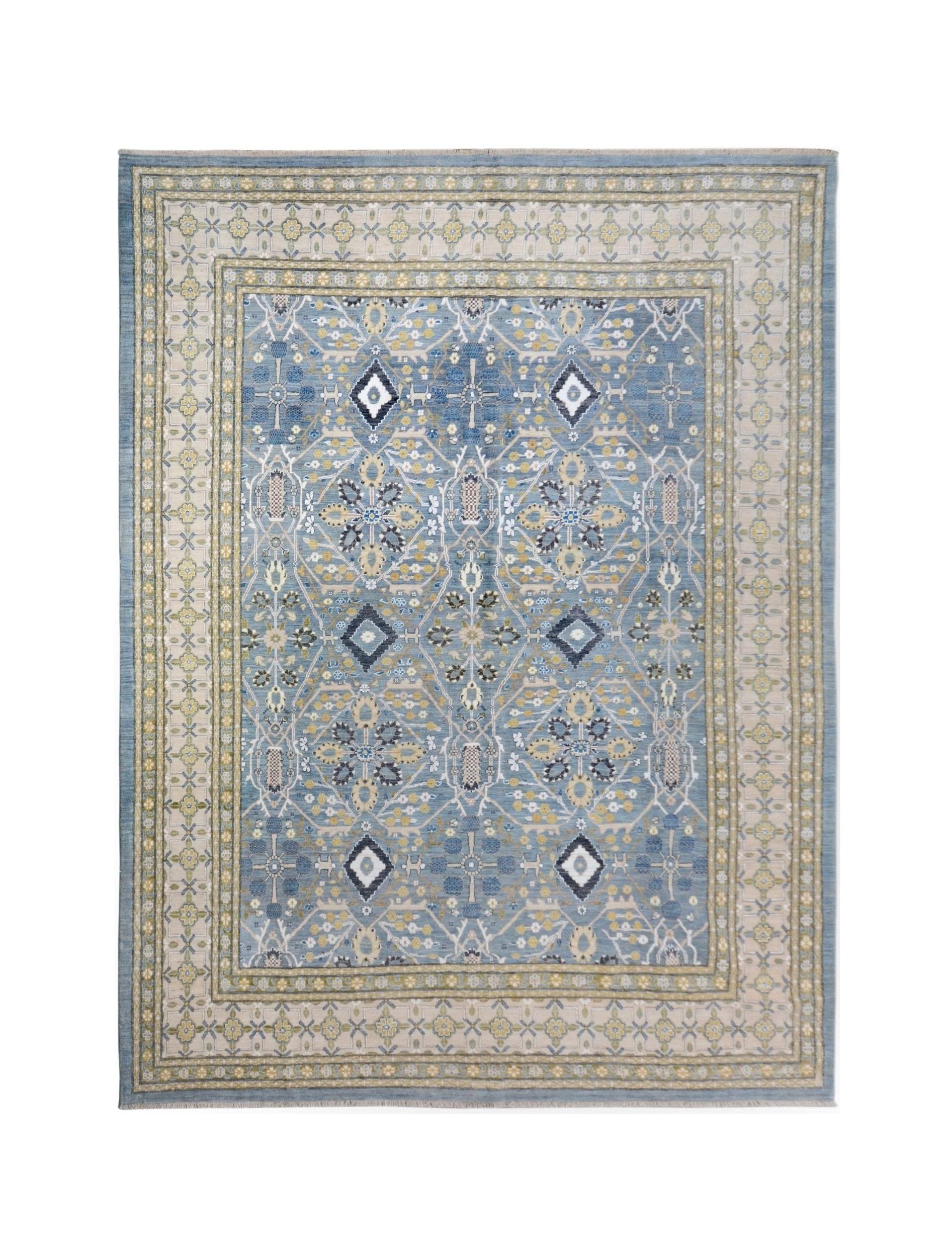 A handmade Afghan Balkh rug featuring a blue field with intricate floral and geometric patterns.