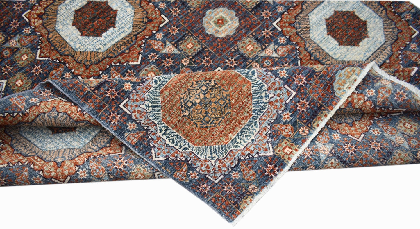 A handwoven Afghan Balkh rug featuring a detailed Mamluk medallion pattern in blue and rust tones.