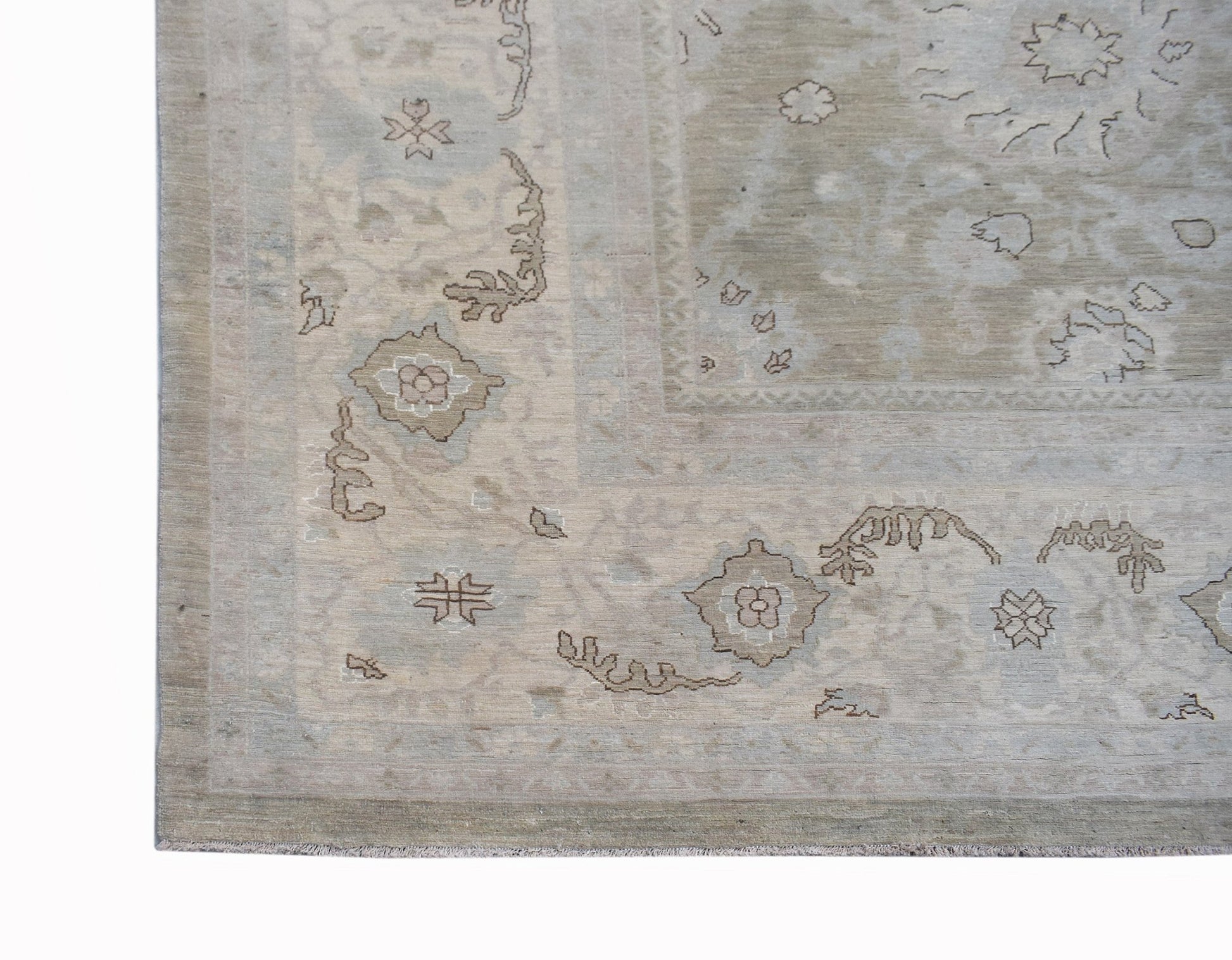 A handwoven Afghan Balkh rug featuring a traditional floral pattern in soft, neutral earth tones.