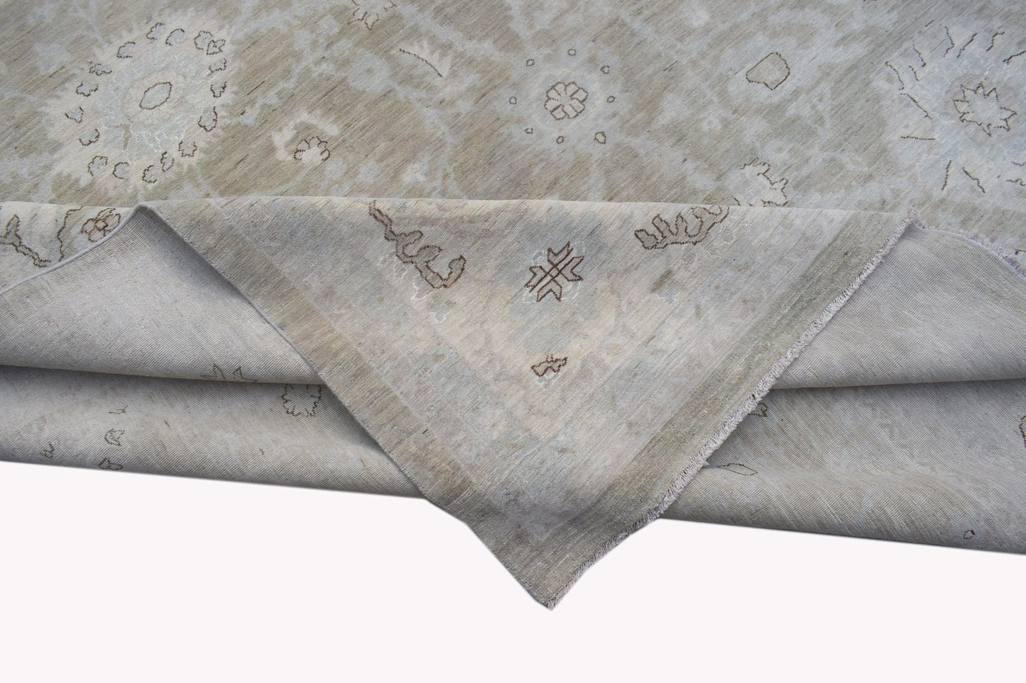 A handwoven Afghan Balkh rug featuring a neutral palette with traditional floral motifs.