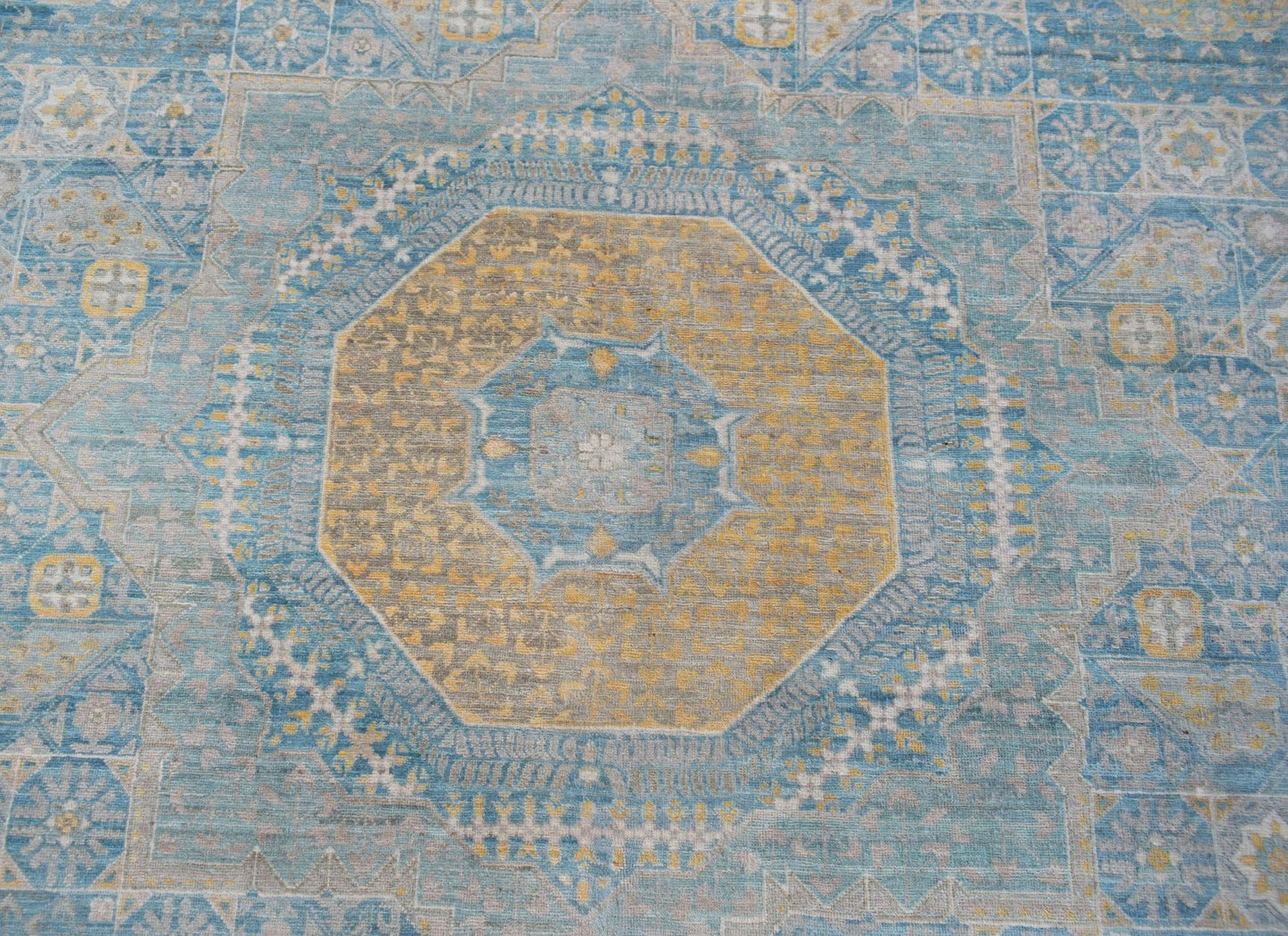 Handwoven Afghan Balkh rug featuring a detailed Mamluk medallion in blue and gold tones.