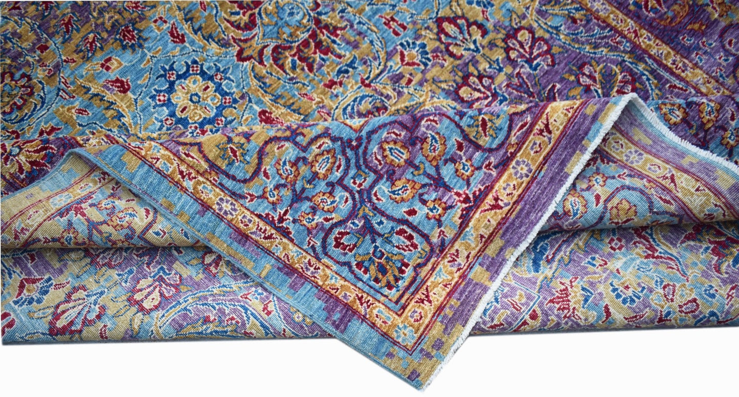 A handwoven Afghan Chobi rug featuring intricate floral patterns in blue, purple, and gold tones.