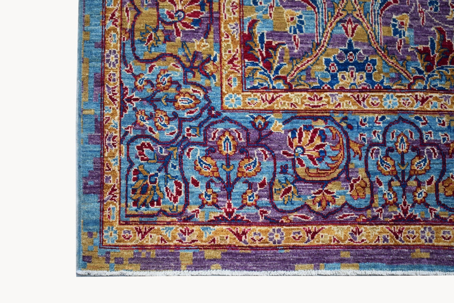 A handwoven Afghan Chobi rug featuring intricate floral patterns in blue, purple, and gold tones.