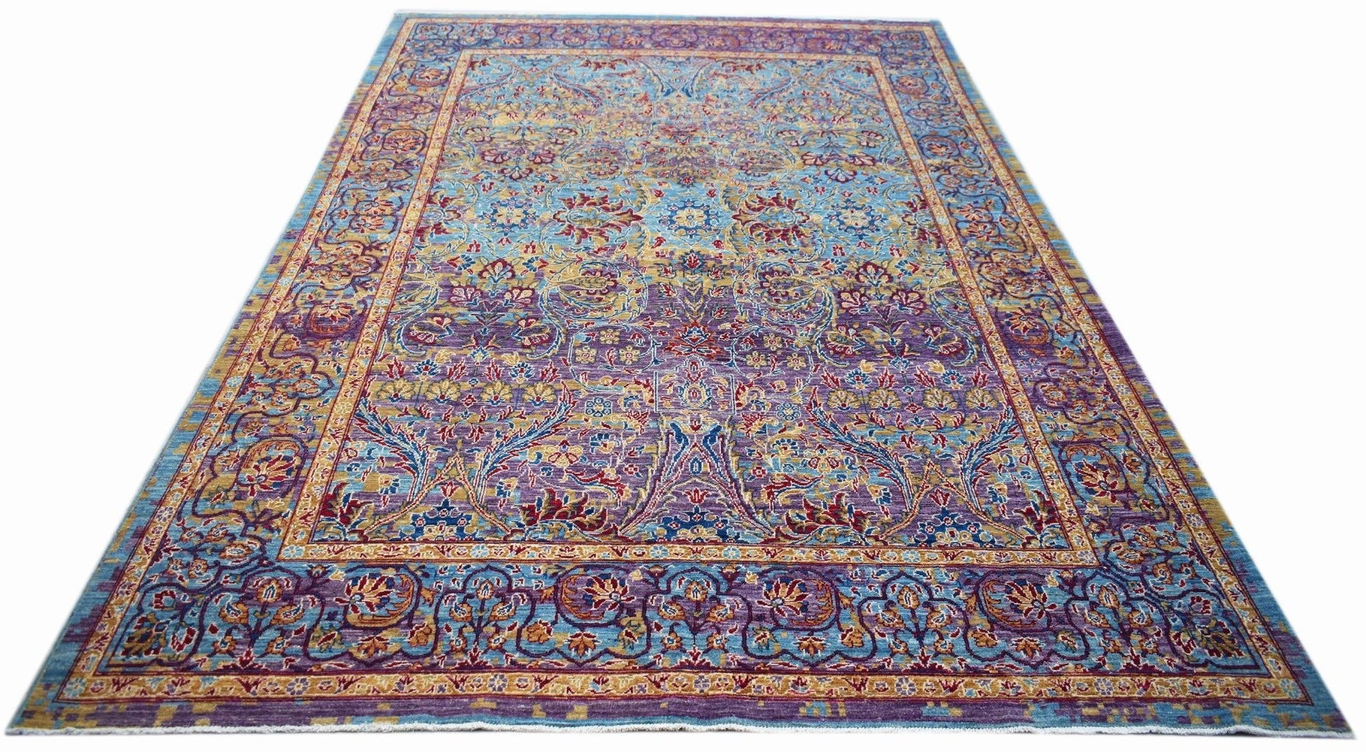 Handwoven Afghan Chobi rug featuring an intricate floral pattern in blue, purple, and gold tones.