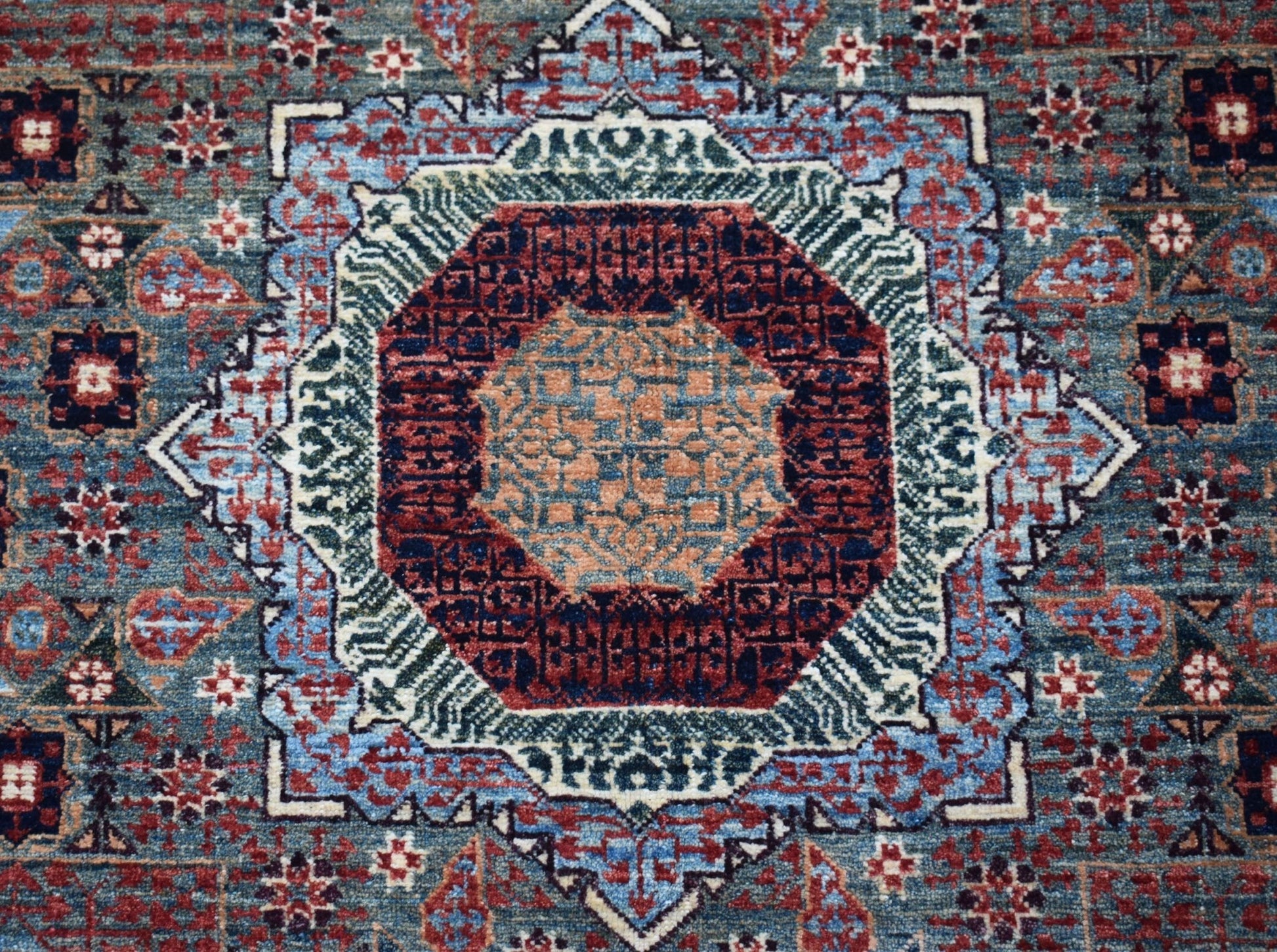 Handwoven Afghan Balkh rug featuring a detailed Mamluk medallion in blue, red, and tan tones.