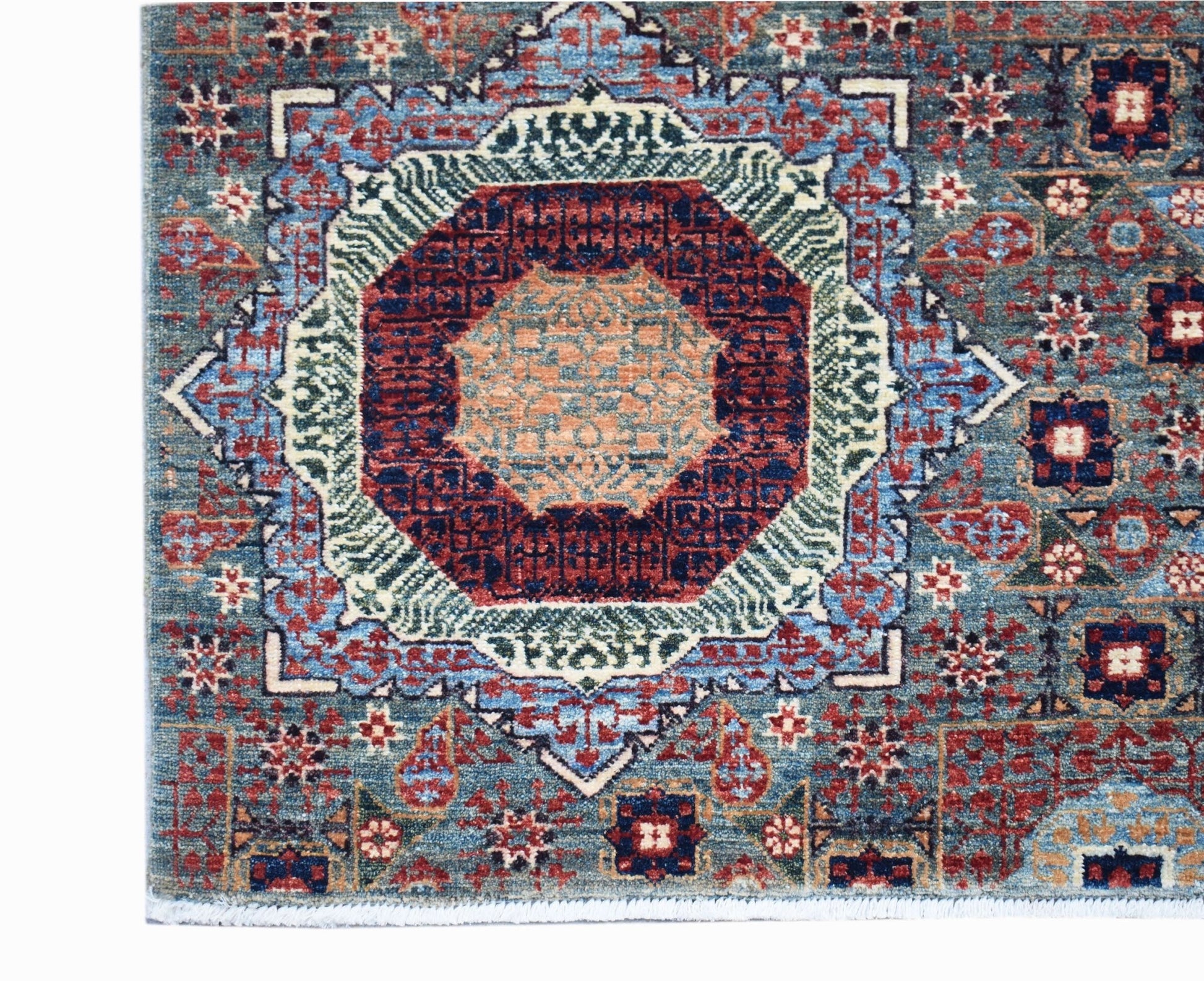 A handmade Afghan Balkh rug featuring a detailed Mamluk medallion pattern in blue and red tones.