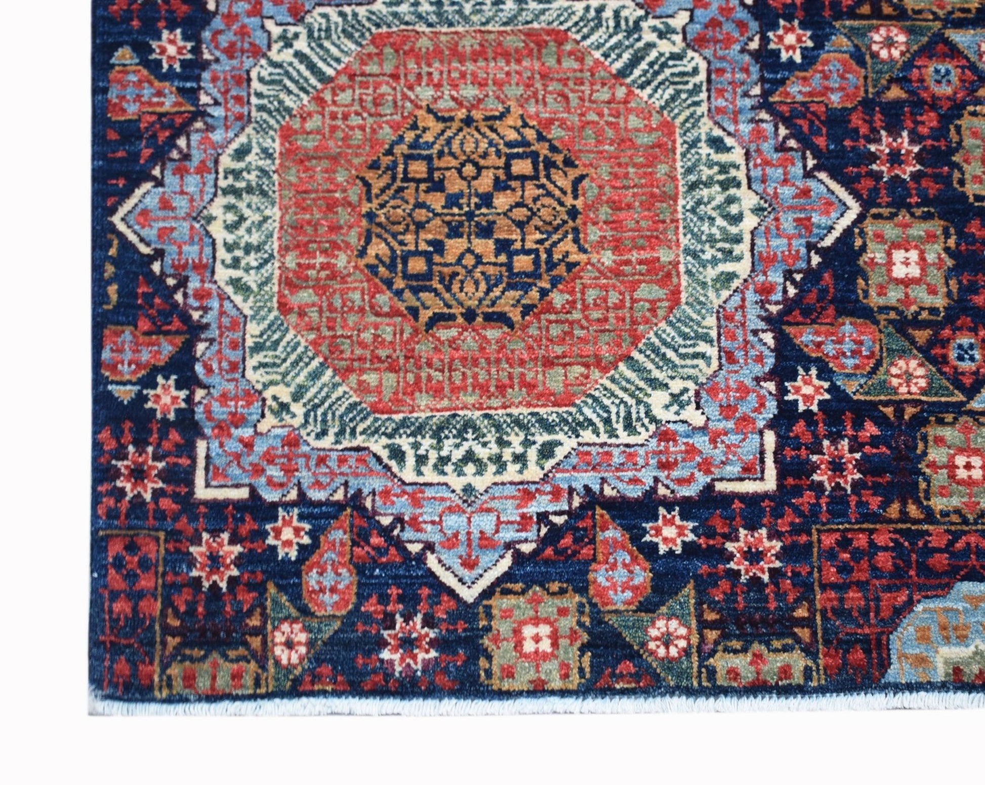 A handmade Afghan Balkh rug featuring a detailed Mamluk medallion pattern in red, blue, and gold.