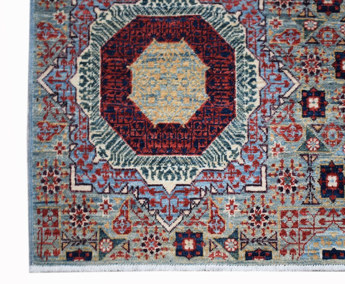 Handwoven Afghan Balkh rug featuring a detailed Mamluk medallion pattern in blue, red, and gold.