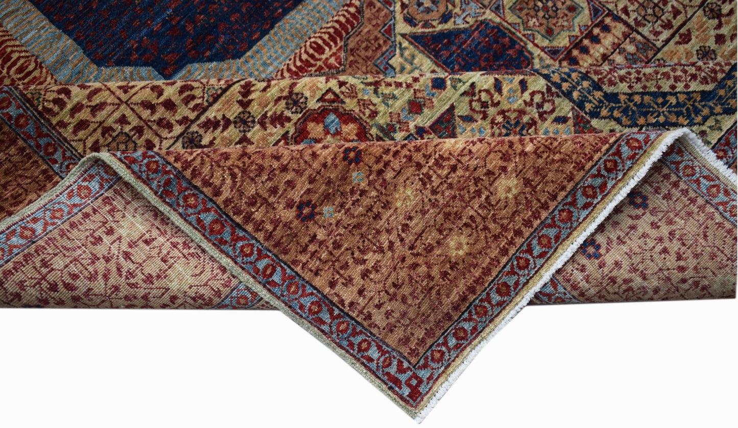 A handwoven Afghan Balkh rug featuring a complex Mamluk pattern in rich blue and earthy tones.