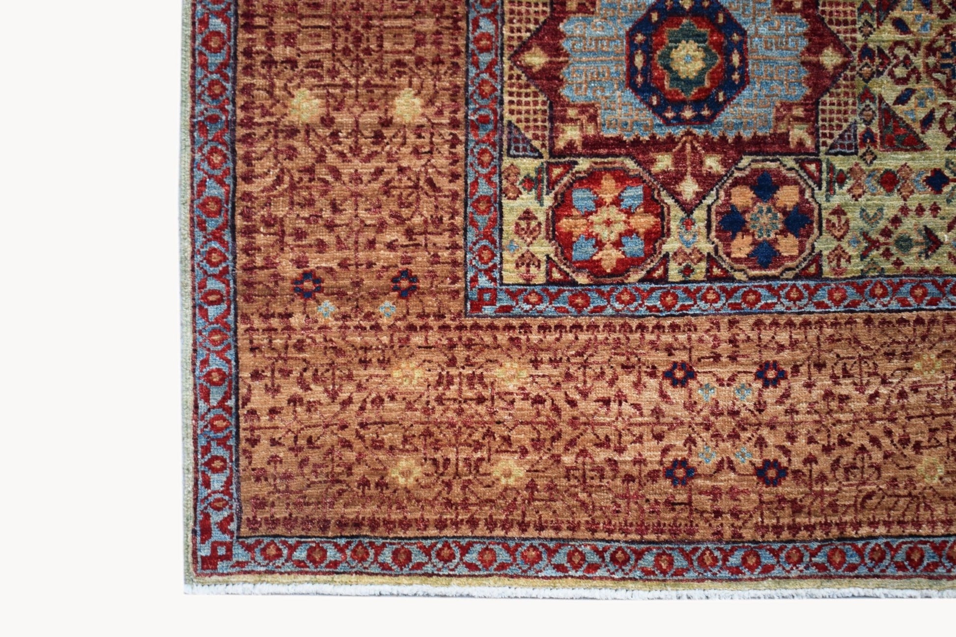 A handmade Afghan Balkh rug featuring a traditional Mamluk medallion pattern in red and blue.
