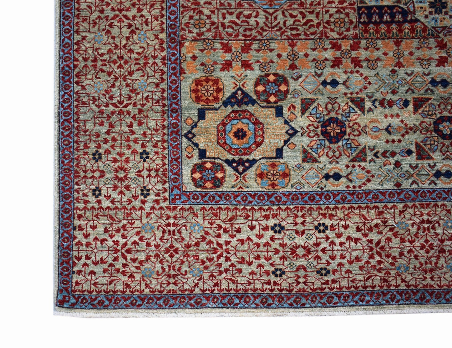 A handmade Afghan Balkh rug featuring a detailed Mamluk medallion pattern in red and blue tones.