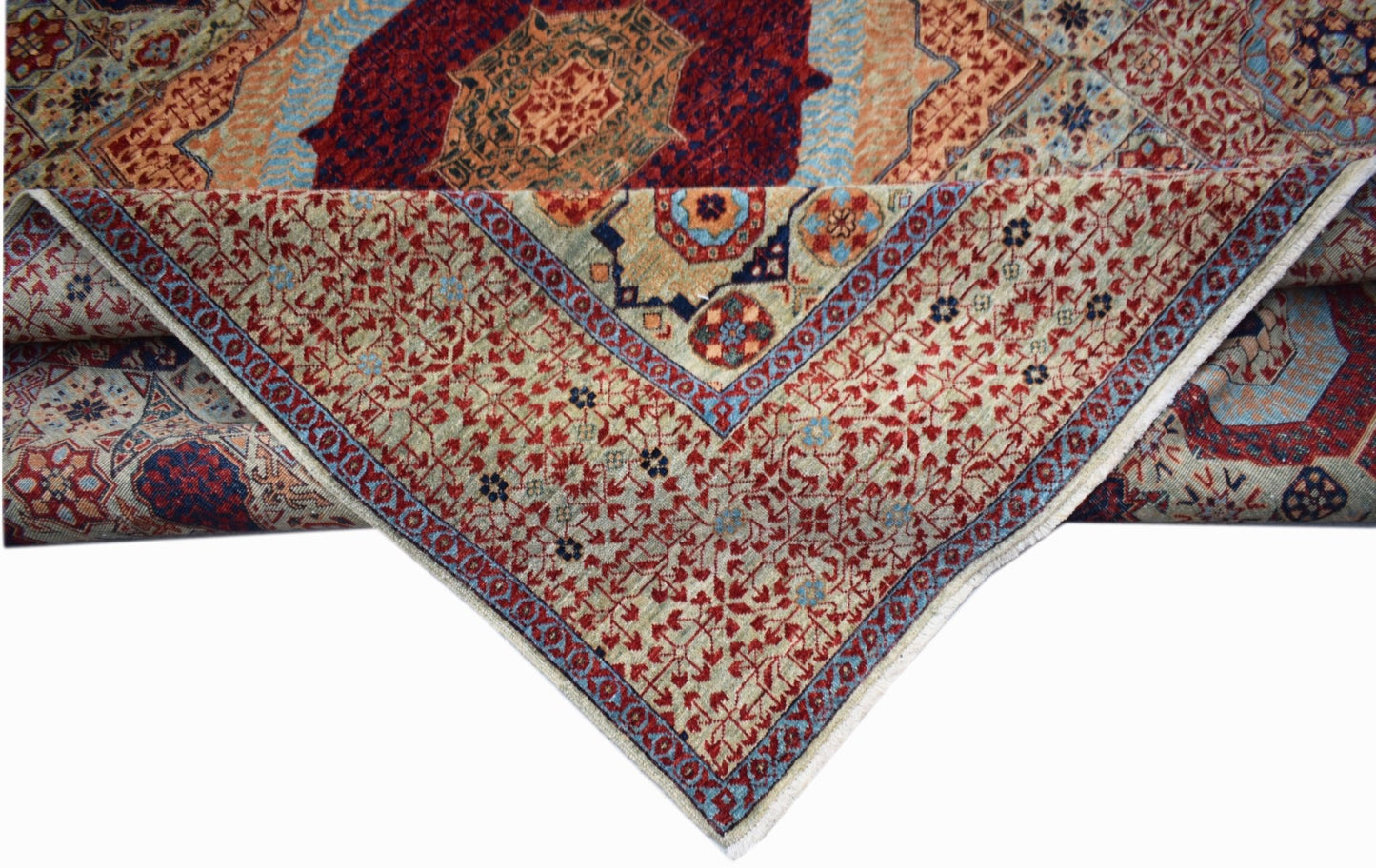 A handwoven Afghan Balkh rug featuring a detailed Mamluk medallion pattern in red and blue tones.